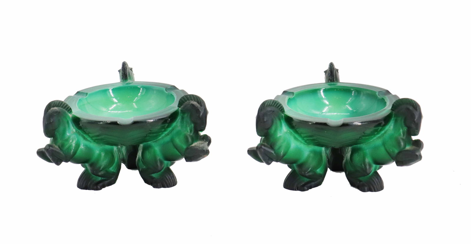 (2) Bohemian Malachite Glass Ashtrays: (2) Bohemian Malachite Glass Ashtrays. Pair of Bohemian malachite glass ashtrays features a vibrant green marbled finish and is supported by three sculptural, frosted black glass figures of rearing ra