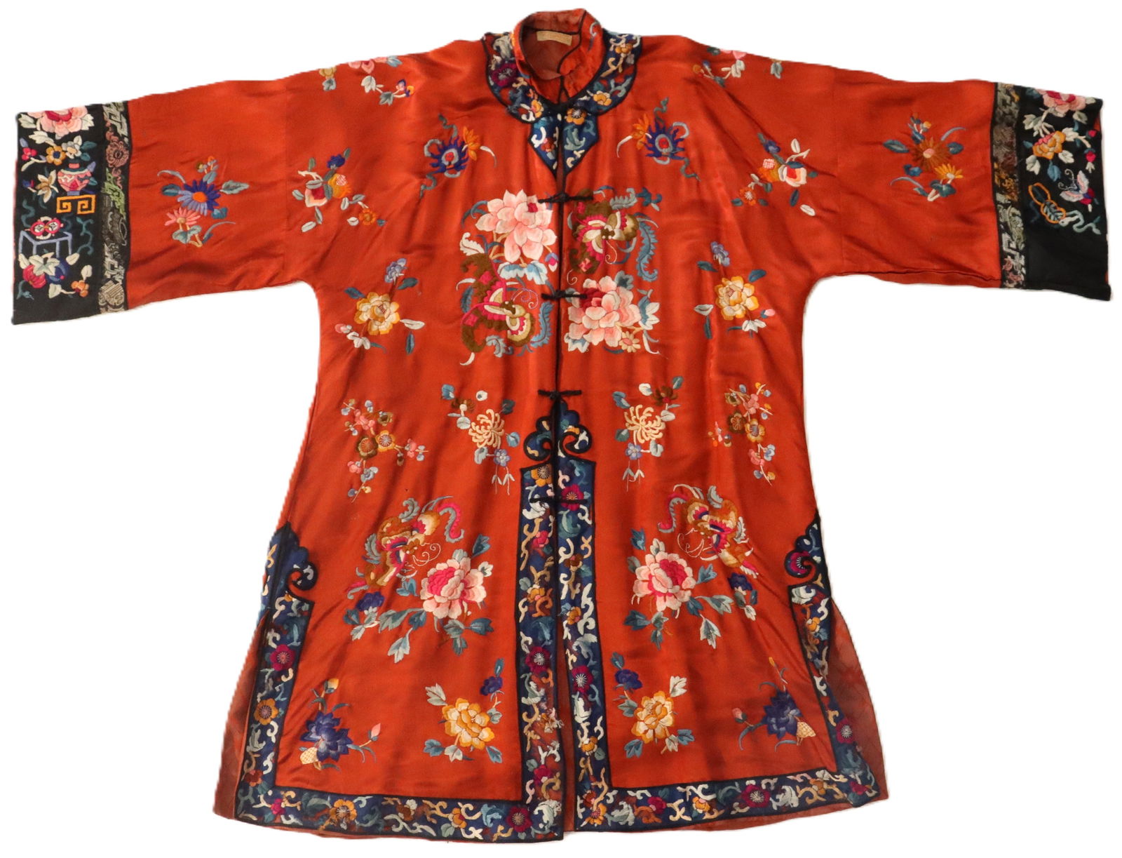 Chinese Embroidered Silk Jacket Robe: Chinese Embroidered Silk Jacket Robe. Taditional Chinese silk robe, woman's informal jacket, featuring vibrant orange-red fabric decorated with colorful floral silk embroidery and contrasting blac