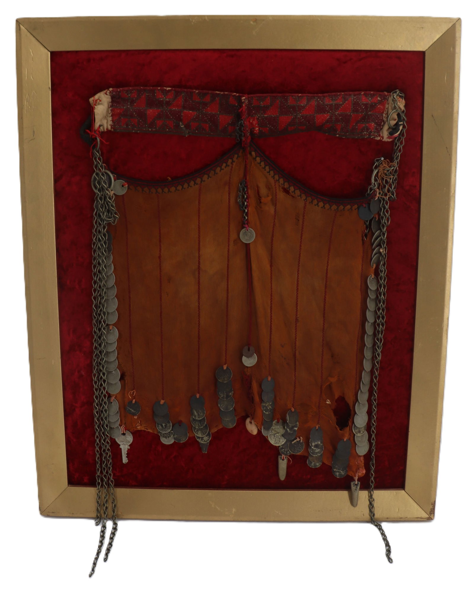 Framed Vintage Middle Eastern Coin and Cloth Burqa Bedouin Face Veil: Framed Vintage Middle Eastern Coin and Cloth Burqa Bedouin Face Veil. Predominantly orange cloth with chains and a variety of coins, as well as beads and a small key. Held in place on a red velvet bac