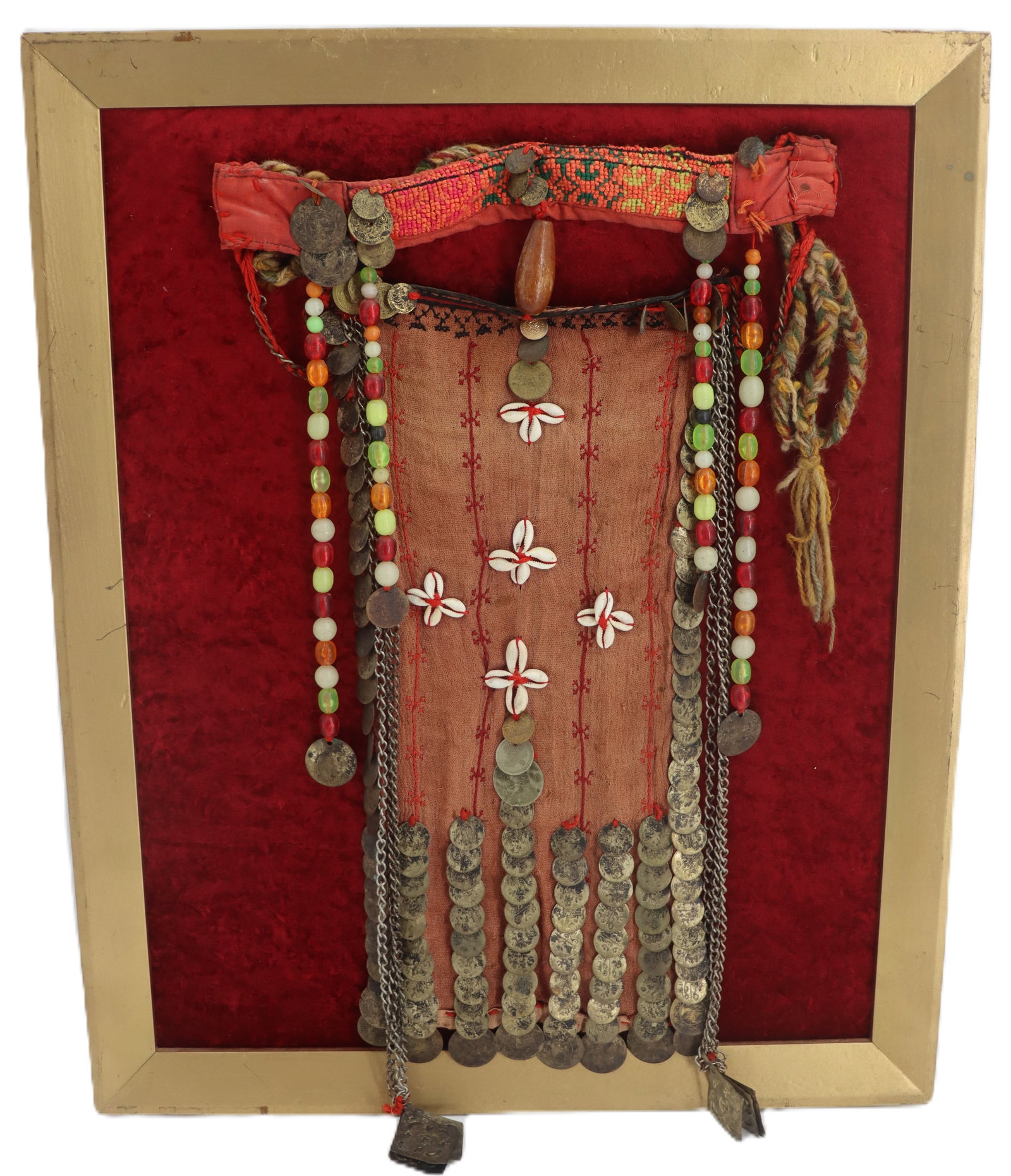 Framed Antique Middle Eastern Coin and Cloth Burqa Bedouin Face Veil: Framed Antique Middle Eastern Coin and Cloth Burqa Bedouin Face Veil. Predominantly orange cloth with chains, multi-colored beads, cowrie shell floral decorations, and a variety of coins. Held in