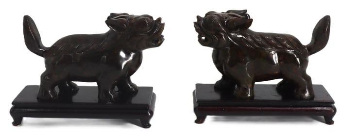 Pair of Dark Polished Stone Chinese Foo Dogs on Wooden Bases