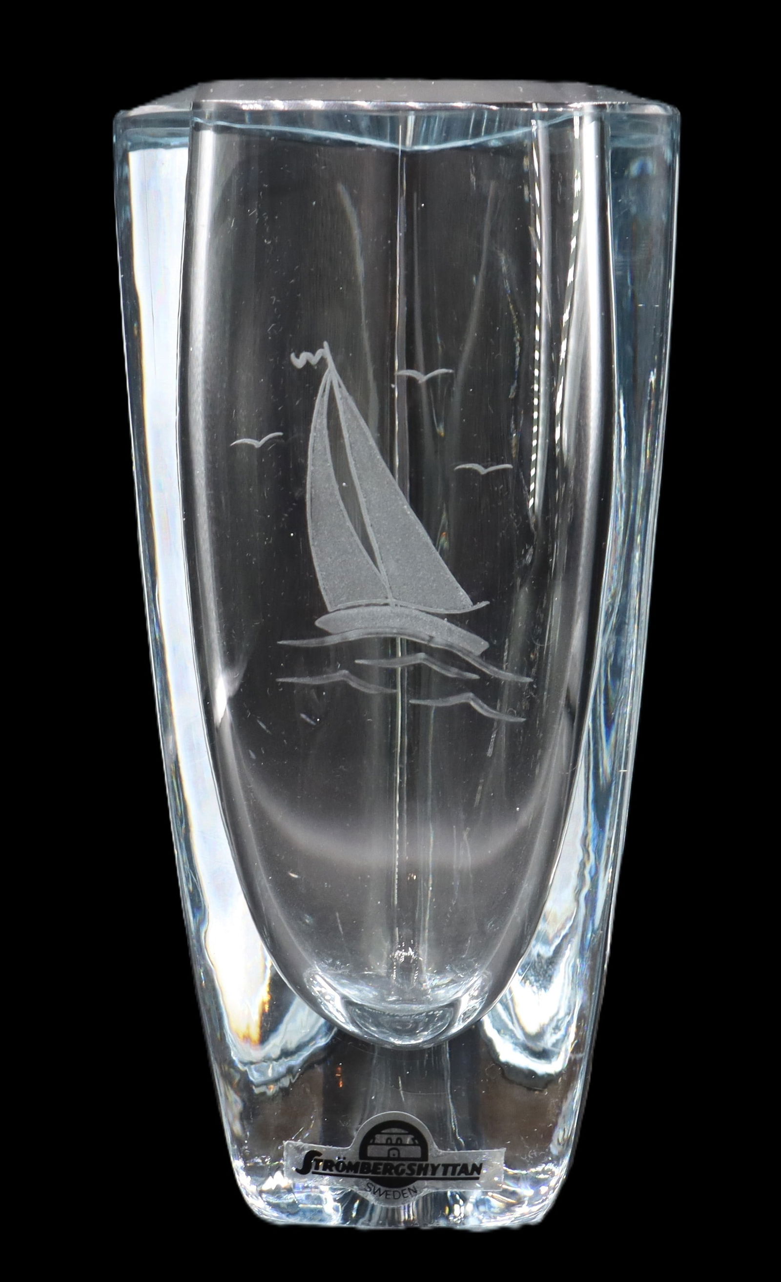Signed Strombergshyttan Art Glass Triangular Vase: Signed Strombergshyttan Art Glass Triangular Vase. Signed on underside. Sticker near base. Made of heavy, thick, clear glass. Sleek, modernist, ovoid columnar shape with rounded corners. Etched