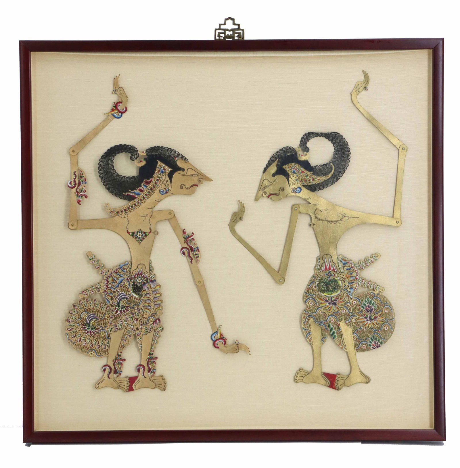 (2) Framed Indonesian Wayang Kulit Shadow Puppets: (2) Framed Indonesian Wayang Kulit Shadow Puppets. Posed as they would be in the show, facing each other. Overall Size: 26 1/4 x 26 3/4 in. Sight Size: 21 x 22 in. The name Wayang