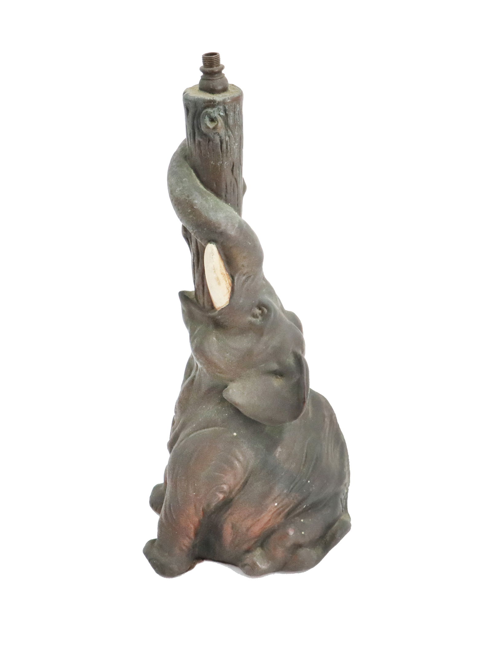 Bronze Seated Elephant Lamp - AS IS: Bronze Seated Elephant Lamp - AS IS. Patinated metal figural lamp base featuring a seated elephant with its trunk curled upward and wrapped around a vertical column carved as a tree. The figure
