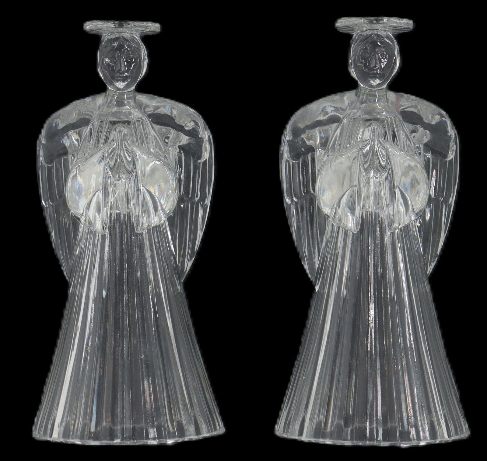 Pair of Vintage Avon Crystal Angel Shaped Candleholders: Pair of Vintage Avon Crystal Angel Shaped Candleholders. Size: 3 x 3 1/4 x 7 1/4 in. In 1886 a bookseller named David H. McConnell discovered that his perfume samples he was including