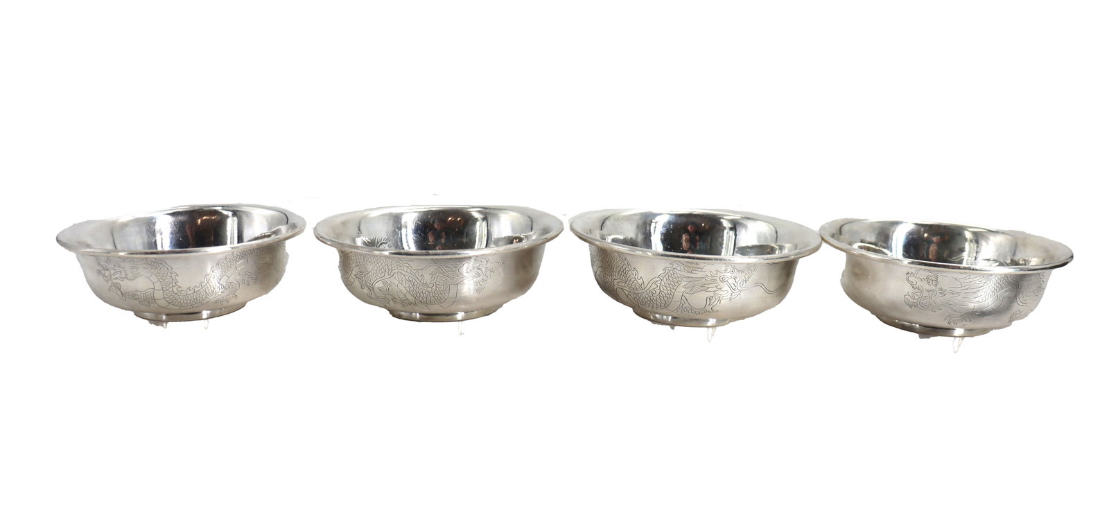 (4) Chinese Sterling Silver Bowls - 22.105 ozt.: (4) Chinese Sterling Silver Bowls - 22.105 ozt. Repoussed dragons adorn the sides of each simply-designed Revere-style bowl. Marked "SILVER" on undersides. Size: 1 3/4 x 5 x 5 in. 