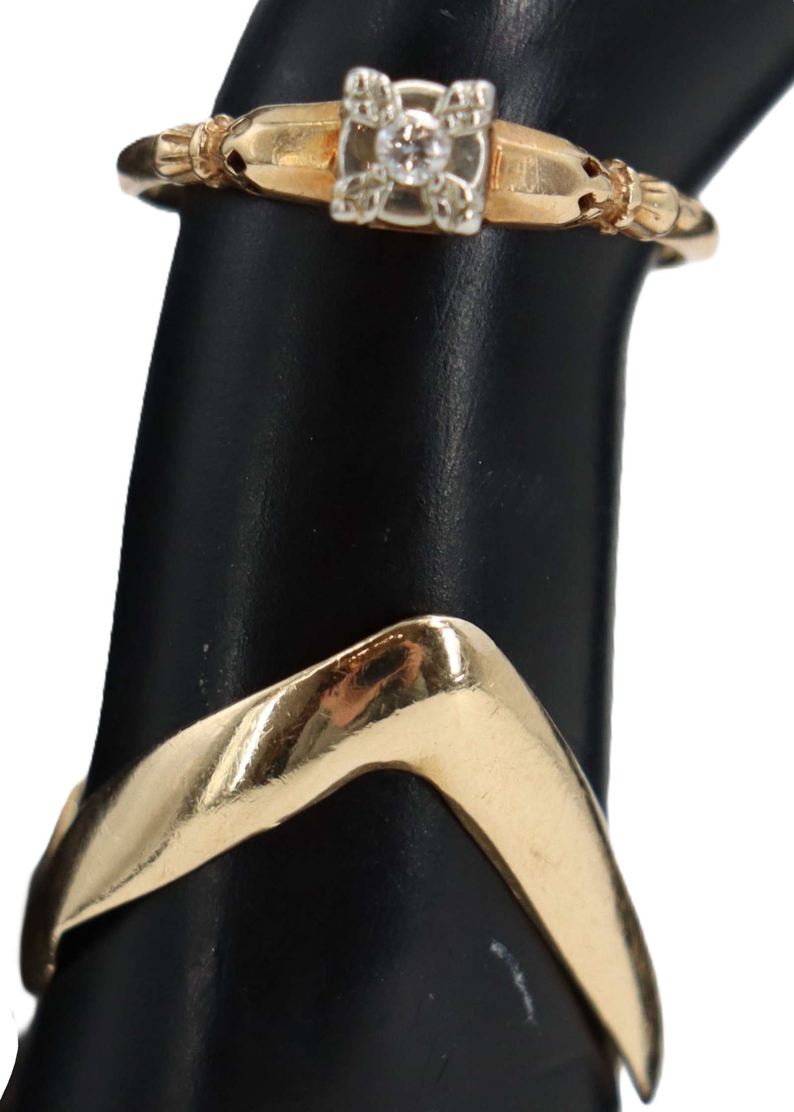 (2) 14k Gold Rings - Gross 3.6 g.: (2) 14k Gold Rings. Marked on inside. One has a bold, sculptural band. Other ring has small round cut glass stones. Yellow gold. Ring Sizes: 5 & 6.5 Gross Weight: 2.3 dwt. 3.6 g. 