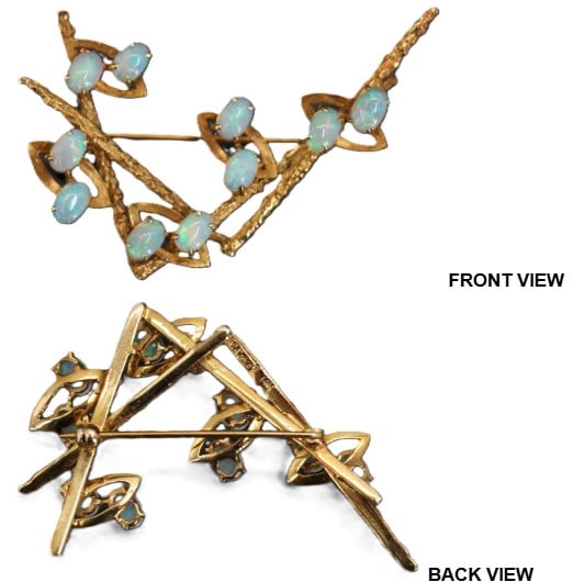 One 14k Gold and Opal Pin - Gross 10.2 g.: One 14k Gold and Opal Pin. Oval cut opals in prong setting. Set in 14k yellow gold. Marked on back. Textured gold. Size: 2 1/4 x 1 1/2 x 1/2 in. Gross Weight: 6.5 dwt. 10.2 g. 
