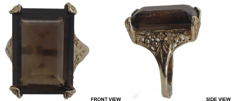 One Marked 14k Gold and Topaz Ring - Gross 5.7 g.: One Marked 14k Gold and Topaz Ring. Marked on inside. Large rectangular cut topaz set in yellow gold. Prong setting. Ornate carved sides on the band. Ring Size: 6.5 Gross Weight: 3.6 dwt.