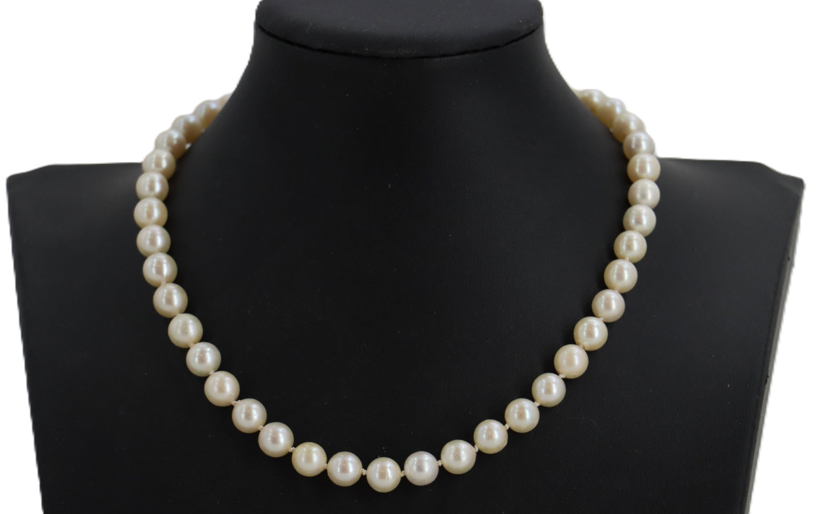 Pearl Necklace With A Marked 14k Gold Clasp: Pearl Necklace With A Marked 14k Gold Clasp. Pearls on clasp; 1 is approximately 5 mm and 6 are approximately 3 mm. Single strand of pearls are approximately 7 mm. Length: 16 1/2 in. 
