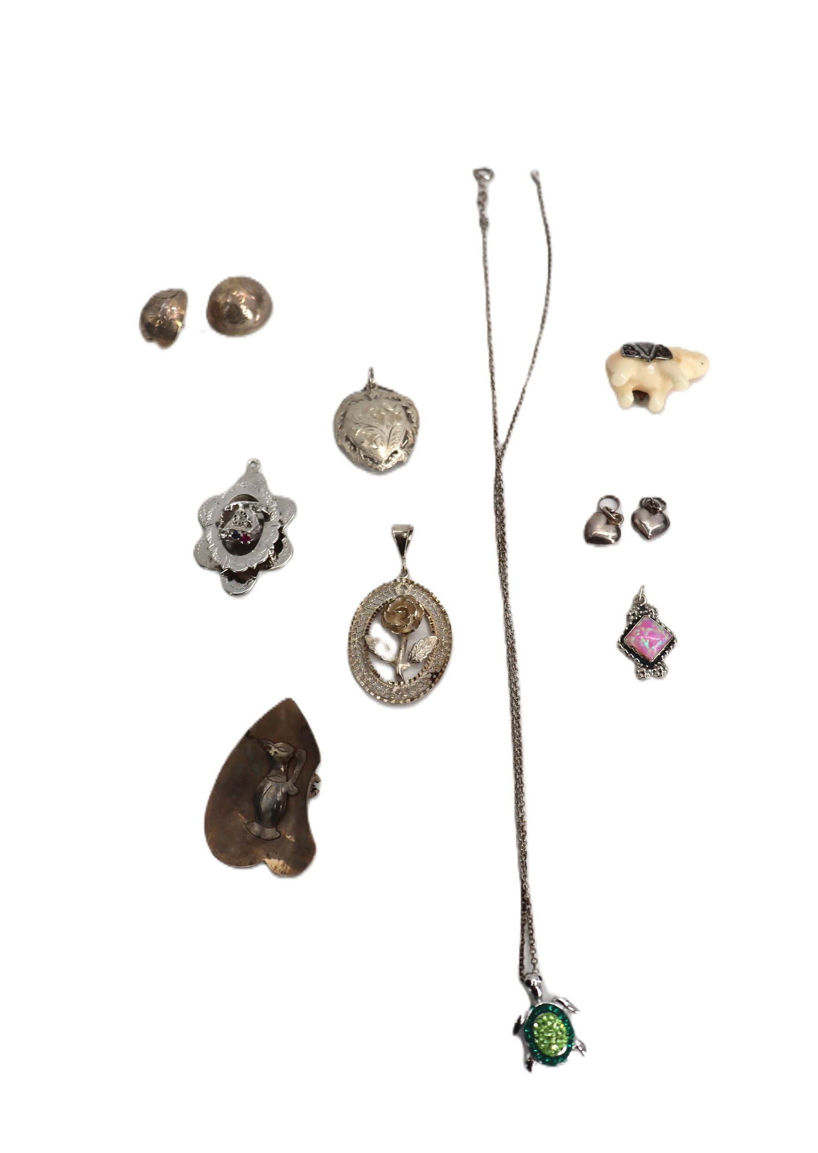 Collection of Sterling Silver Jewelry - Gross 0.970 ozt.: Collection of Sterling Silver Jewelry. Includes one necklace with turtle pendant, one pair of earrings (One doesn't have its post), 3 pendants, 1 pin/pendant, and 4 charms. Length: 18 in.&nb