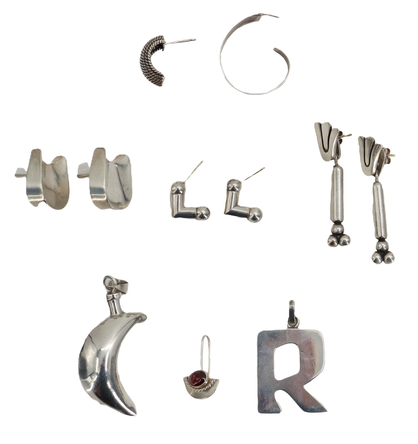 Miscellaneous Silver Jewelry Pieces - 2.30 ozt.: Miscellaneous Silver Jewelry Pieces. Several earrings and a couple of pendants. Marked on back. Largest Size: 1 x 1 1/2 in. Weight: 2.310 ozt. 