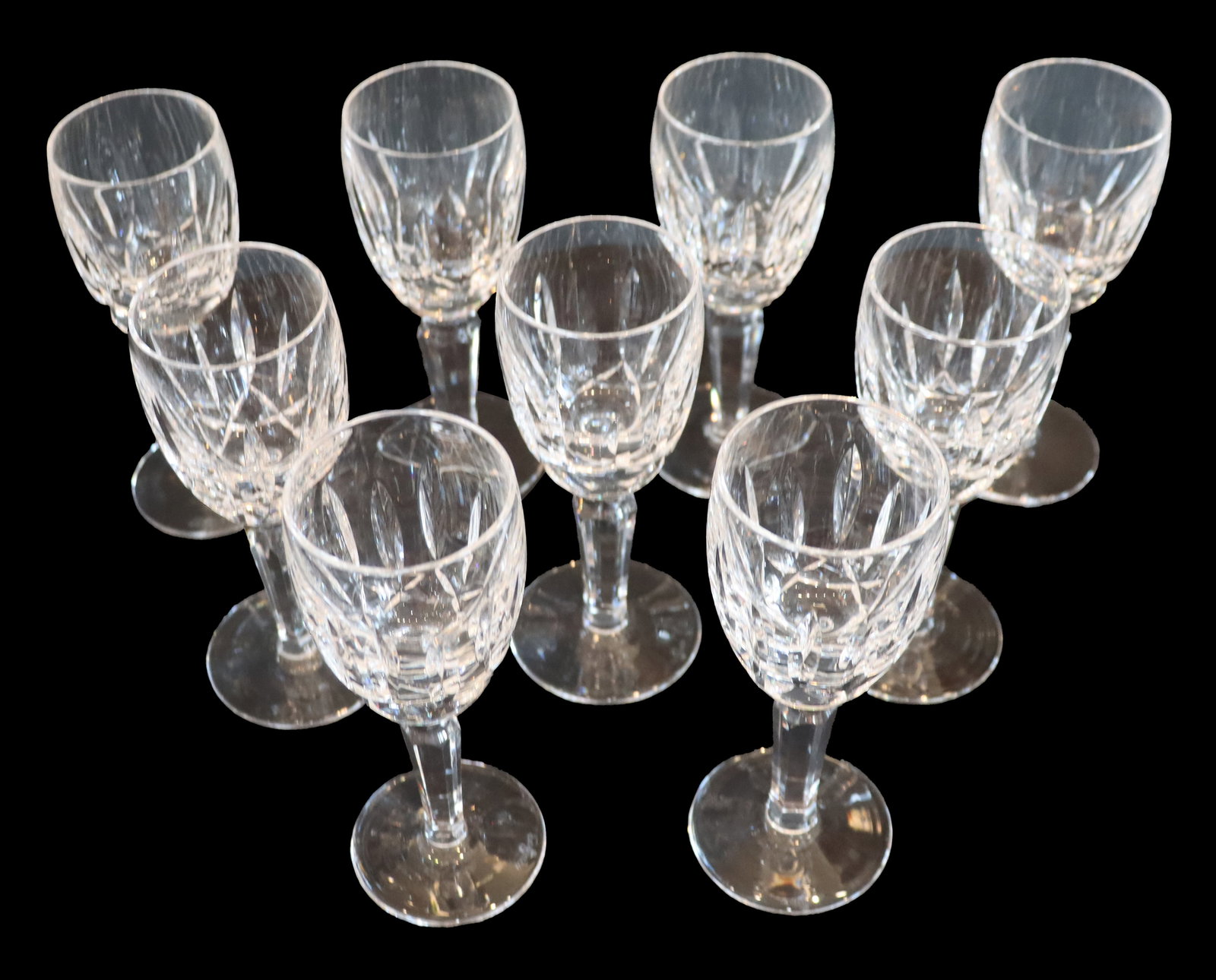 (9) Waterford Crystal Lismore Cordial Glasses: (9) Waterford Crystal Lismore Cordial Glasses. The etched pattern appears on the body. Marked on the underside of the foot. 8 have the seahorse marking, 1 has the words marking. Size: 
