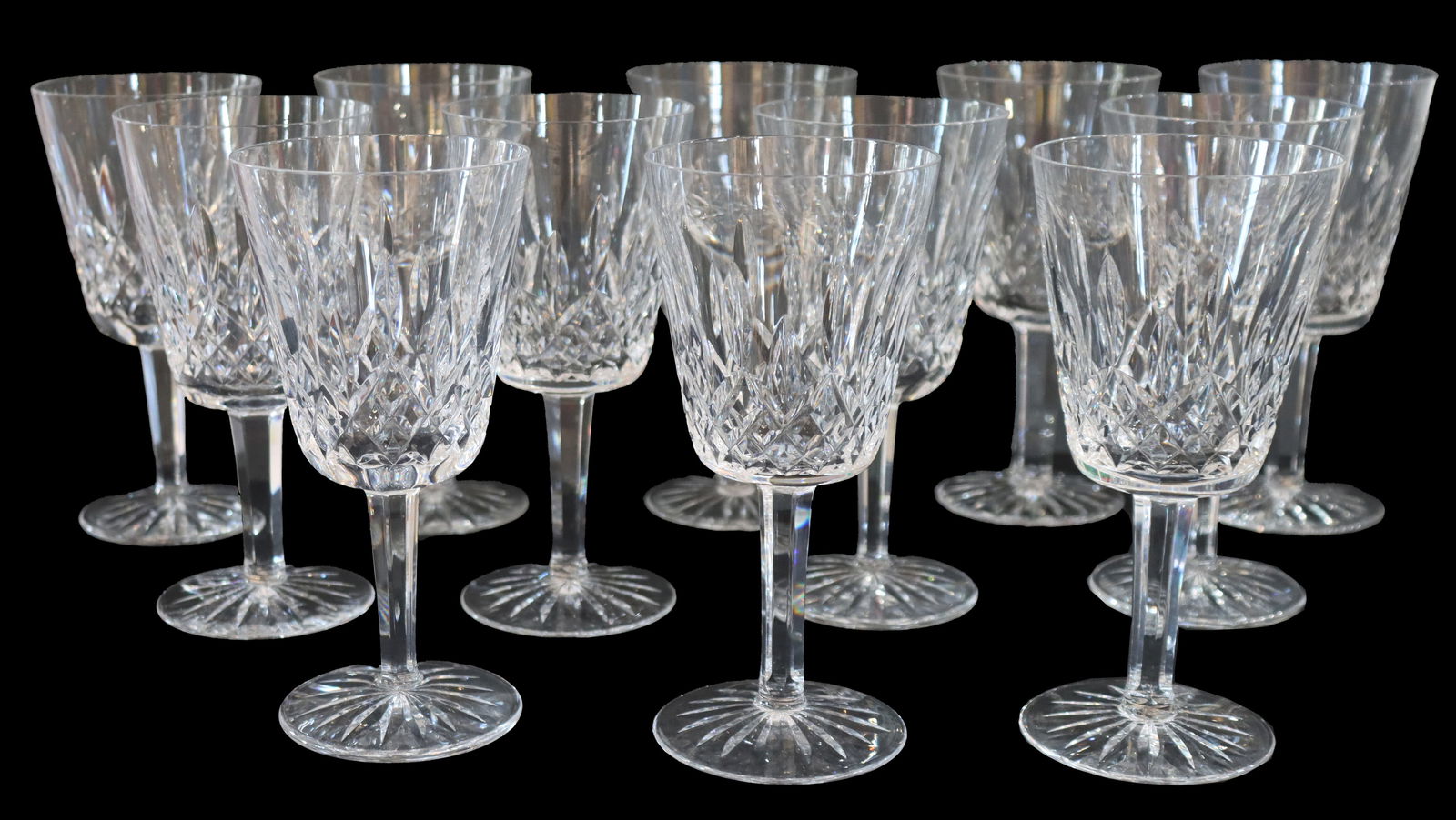 (12) Waterford Crystal Stemmed Water Goblets: (12) Waterford Crystal Stemmed Water Goblets. Cut glass pattern on the body and feet. 8 are marked with just the word "Waterford," while 4 have a mark that includes the seahorse lo
