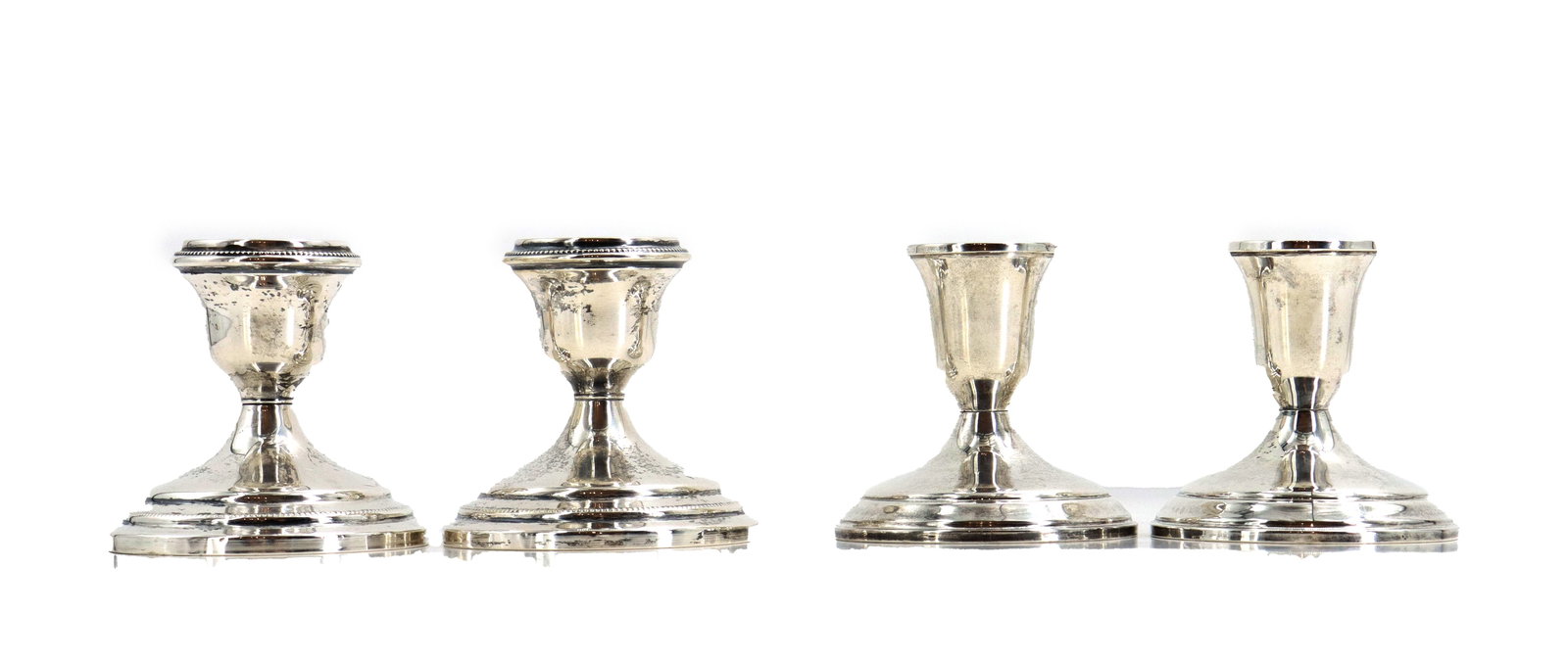 (4) Towle Sterling Silver Weighted Candleholders: (2) Revere and (2) Towle Sterling Silver Weighted Candleholders. Marked on the undersides. Size: 3 x 4 1/2 in. Towle Silversmiths began as the artisanal shop of William Moulton,