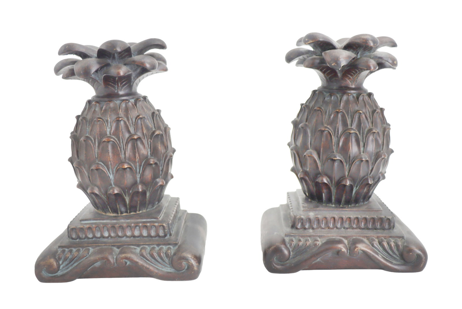Pair of Bronzed Ceramic Pineapple Bookends with Bronzed Wood Bases: Pair of Bronzed Ceramic Pineapple Bookends with Bronzed Wood Bases. Size: 6 3/4 x 5 x 3 1/2 in. 