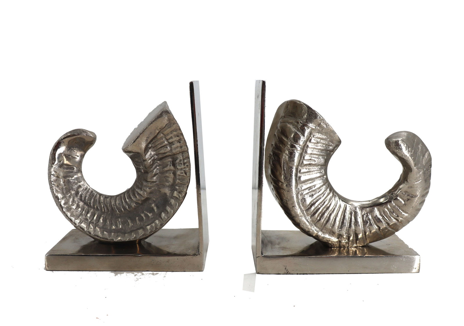 Pair of Max Studio Home Silvered Metal Ram Horn Bookends: Pair of Max Studio Home Silvered Metal Ram Horn Bookends. The sculptural curved pieces are attached to the bottom of the L shaped base, but not the side, giving the appearance that they are freestandi