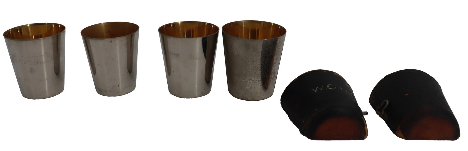 (4) Vintage German Barware Chrome Travel Shot Glasses with (1) Leather Case - AS IS: (4) Vintage German Barware Chrome Travel Shot Glasses with (1) Leather Case - AS IS. All have a golden hue inside with a shiny chrome exterior, marked "Germany" on the undersides. The m