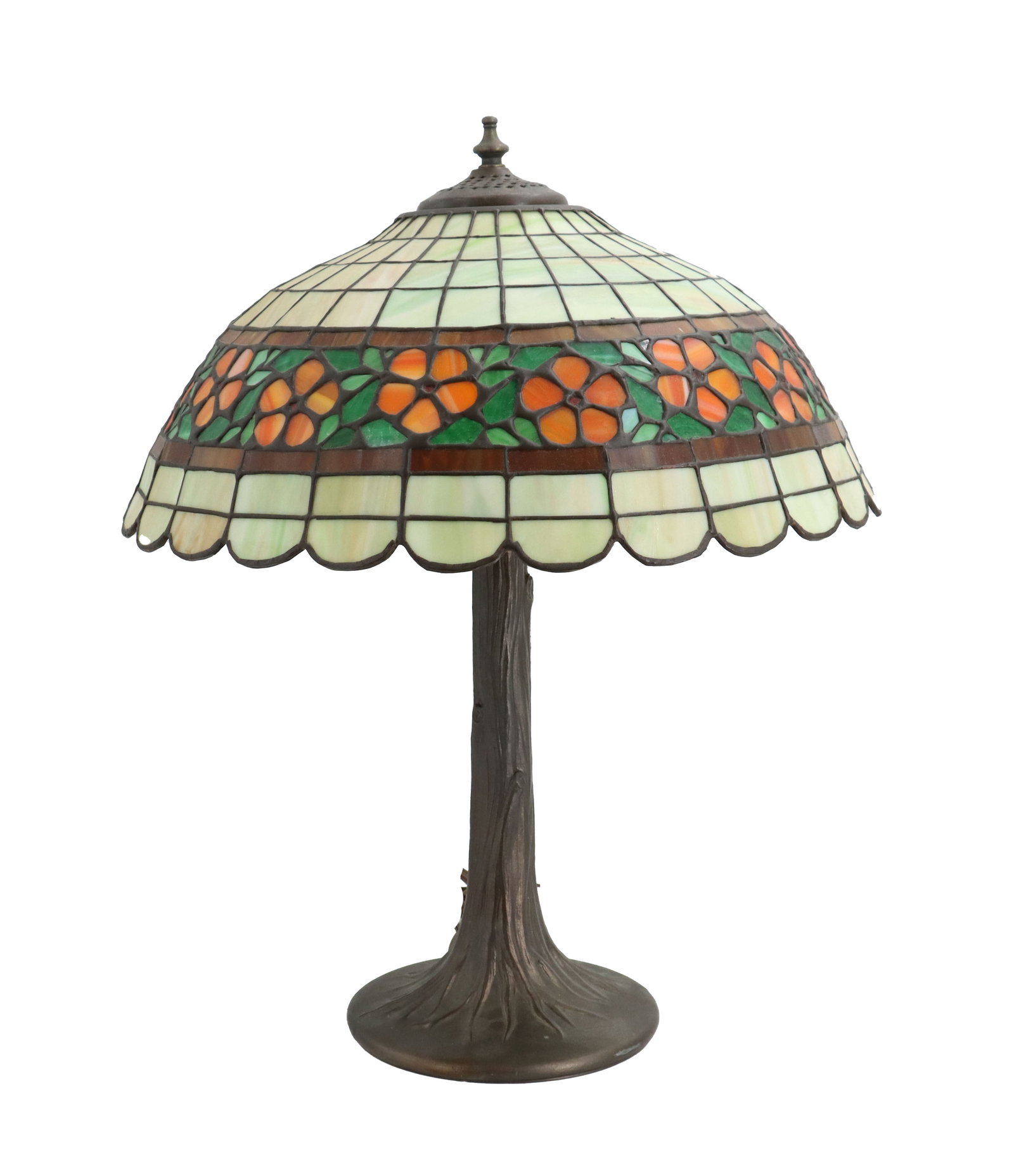 Tiffany Style Stained Glass Table Lamp: Tiffany Style Stained Glass Table Lamp. Decorative Tiffany-style table lamp featuring a domed stained-glass shade with a band of orange flowers and green leaves, supported by a bronze-finished base mo
