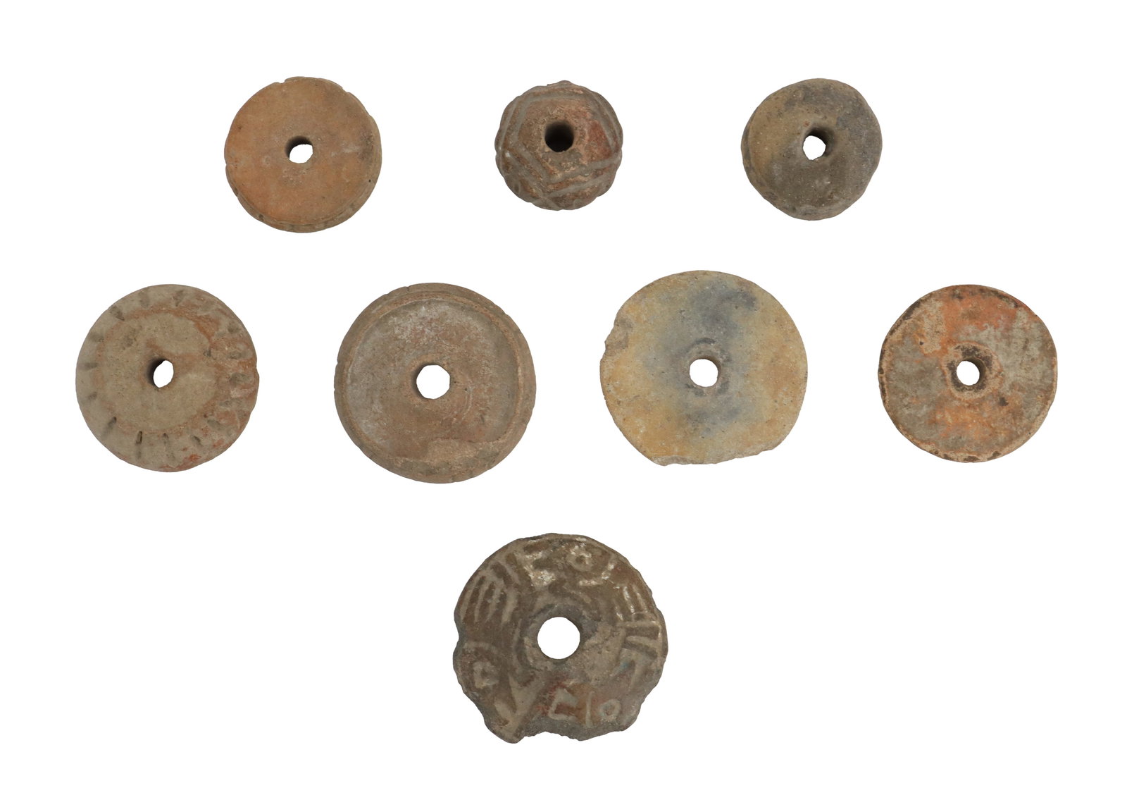 (8) Pre-Columbian Terracotta Textile Spindle Whorls: (8) Pre-Columbian Terracotta Textile Spindle Whorls. Made by many different cultures, spindle whorls are typically perforated terracotta weights used to twist fiber, used to control spin spe