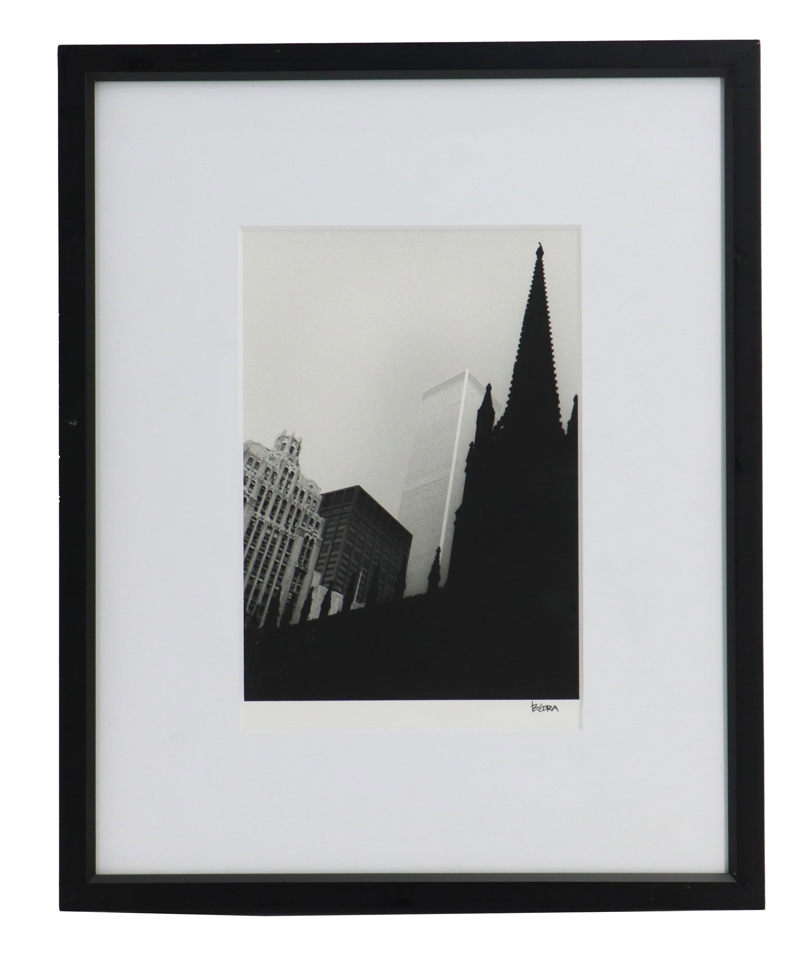 B. Gora (20th Century) American, Black and White Photograph of the World Trade Center: B. Gora (20th Century) American, Black and White Photograph of the World Trade Center. Black-and-white photograph depicting a low-angle architectural view of New York City, featuring the stark silhoue