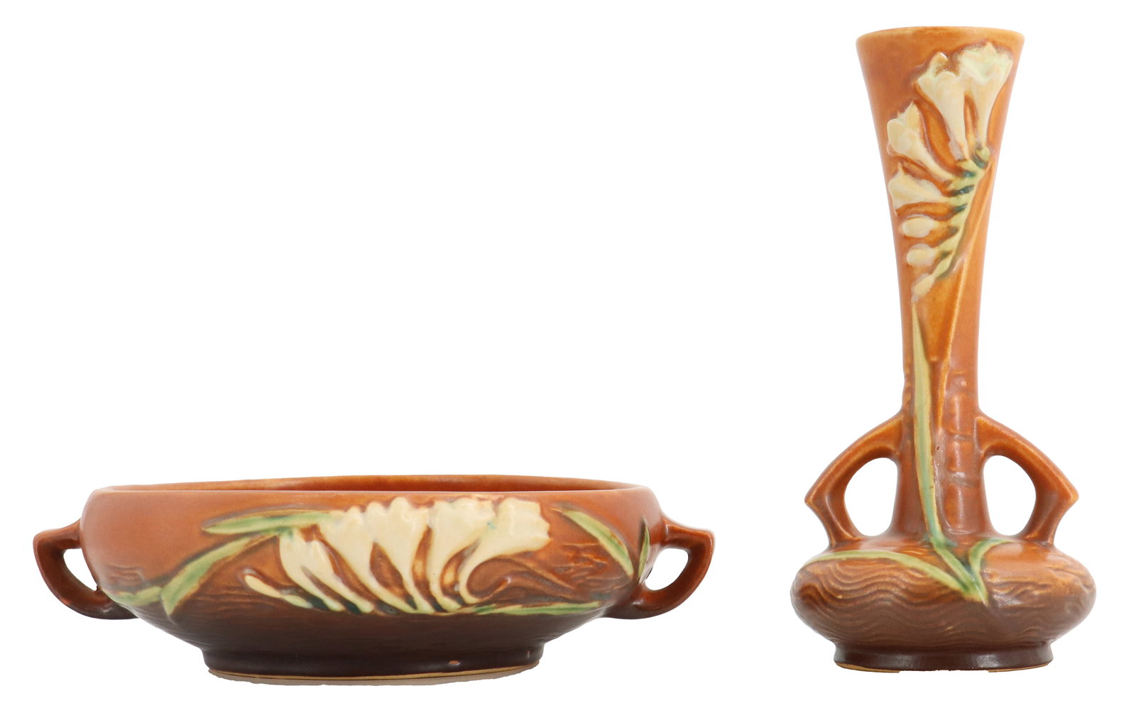 (2) Roseville Pottery Freesia Bowl and Bud Vase: (2) Roseville Pottery Freesia Bowl and Bud Vase. Collection consists of a low, two-handled console bowl and a slender bud vase, both from the Roseville Clematis art pottery line featuring a warm