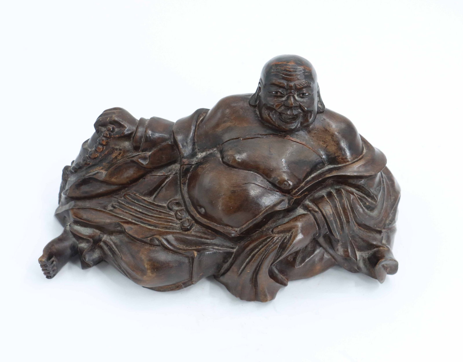 Vintage Chinese Carved Rosewood Hotei Laughing Buddha: Vintage Chinese Carved Rosewood Hotei Laughing Buddha. A large number "21" is carved into the underside of the piece. Size: 6 x 10 x 5 in. The Hotei or Budai, also known as the L