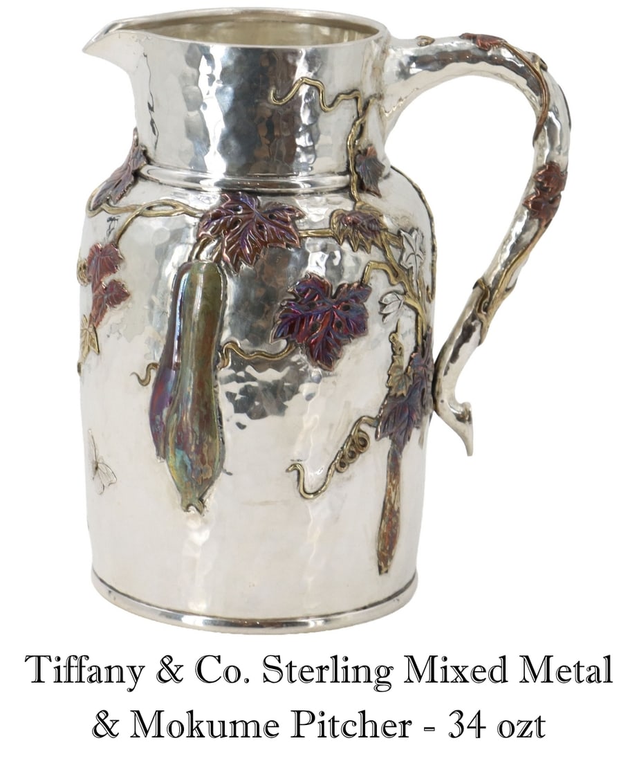 Fantastic Tiffany & Co. Sterling Mixed Metal & Mokume Pitcher - 34.465 ozt.: Fantastic Tiffany & Co. Sterling Mixed Metal & Mokume Pitcher. Two sponge gourds are mokume gane. Great pitcher with a vine design, dragonfly, leaves and gourd. Marked on underside. 