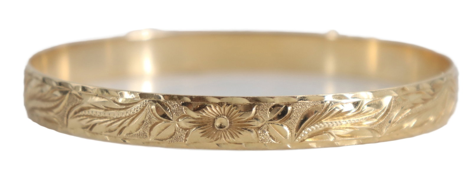 14k Gold Bangle Bracelet - 18.6 g.: 14k Gold Bangle Bracelet - 18.6 g. 14k gold bangle featuring an intricate floral and leaf engraving around its exterior band. Marked on inside. Size: 2 5/8 x 2 1/4 x 1/4 in.&