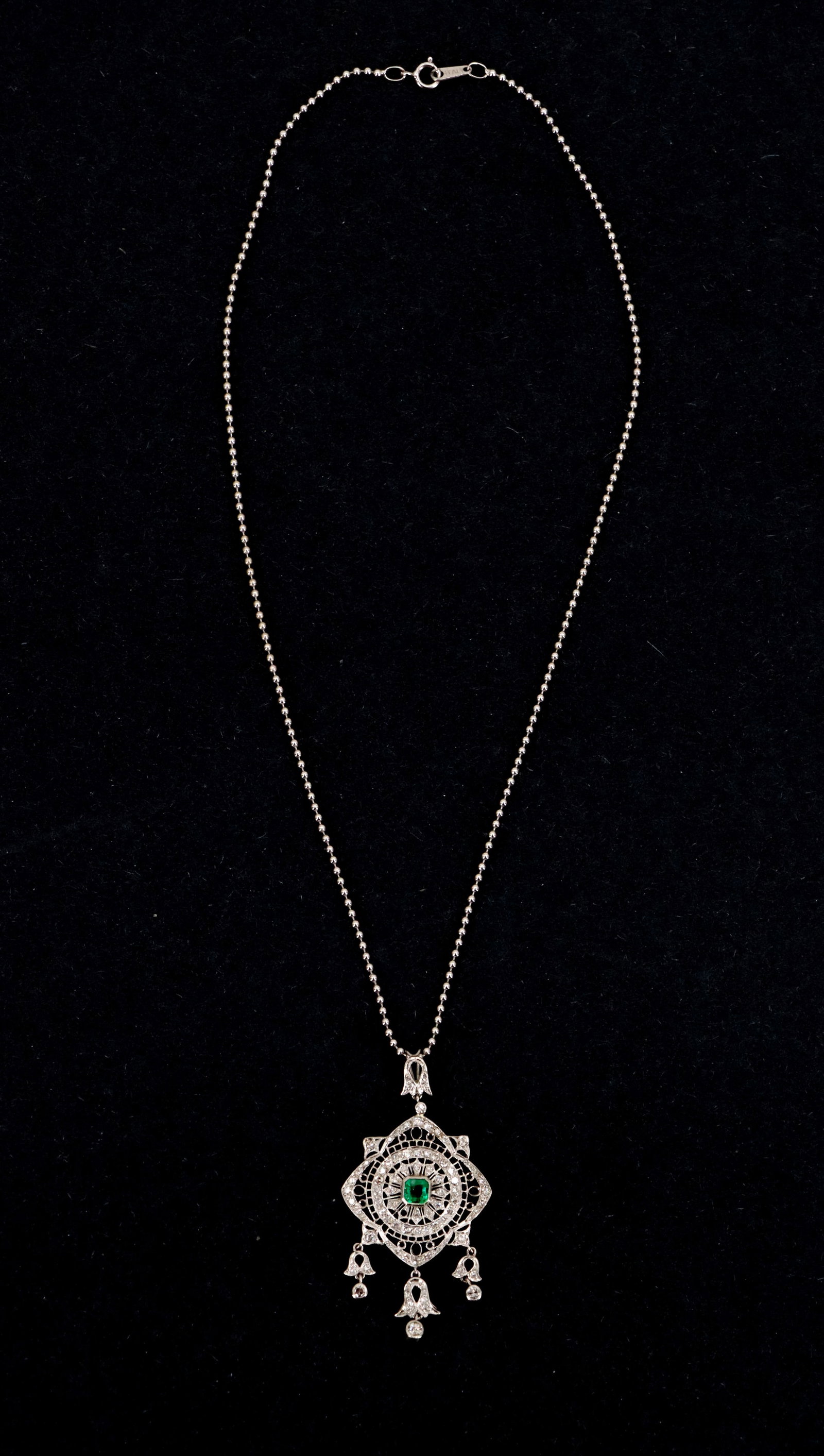 Tested Vintage Filigree 18k White Gold with Diamonds and Emerald - Gross 10.5 g.: Tested Vintage Filigree 18k White Gold with Diamonds and Emerald - Gross 10.5 g. Delicate white gold filigree pendant features a central square-cut emerald surrounded by intricate diamond-accented lac