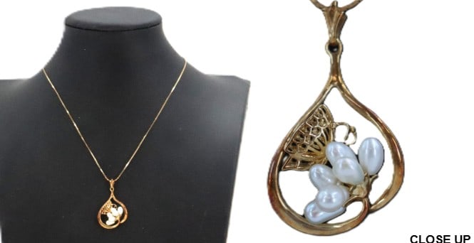 Hanae Mori (1926-2022) Japanese, "The Kiss of the Golden Butterfly" 14k Gold and Freshwater Pearls: Hanae Mori (1926-2022) Japanese, "The Kiss of the Golden Butterfly" 14k Gold and Freshwater Pearls Pendant Necklace - Gross 5.1 g. The beautiful pendant shows a butterfly resting on a flower