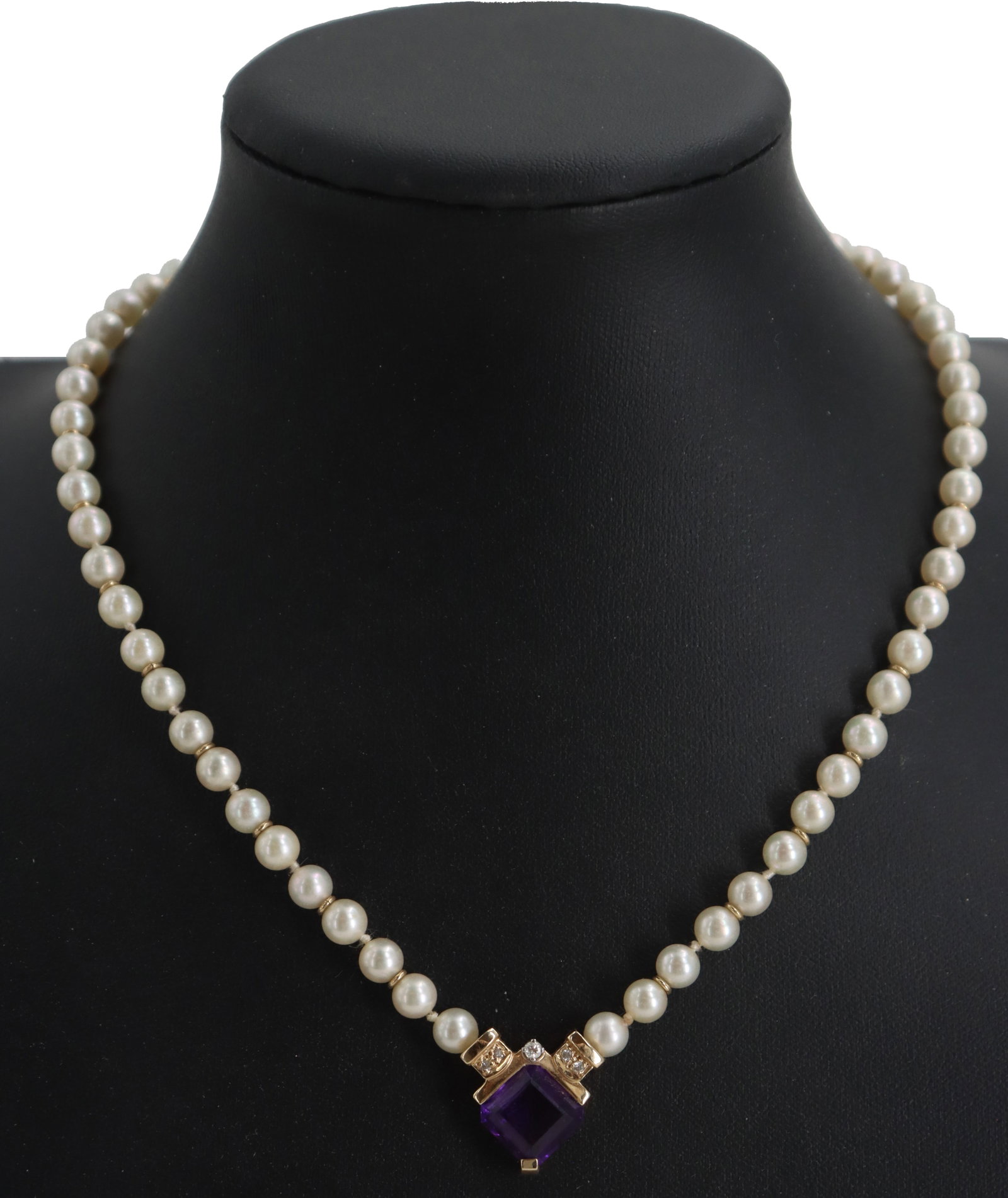 Pearl, Diamond, and Amethyst Necklace: Pearl, Diamond, and Amethyst Necklace. Classic necklace features a strand of uniform cream-colored pearls accented by gold spacers and a central, square-cut purple amethyst pendant flanked by small di