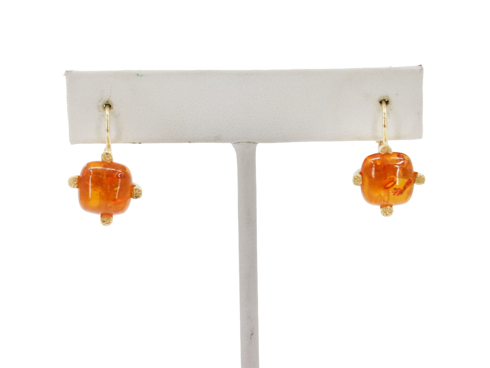 (2) 14K Yellow Gold and Amber Earrings - 5.5 g.: (2) 14K Yellow Gold and Amber Earrings - 5.5 g.. Elegant earring features a square, polished amber stone set in 14K yellow gold with textured, dotted accents at each side. Size: 1 in. Weight: 5.5 g.