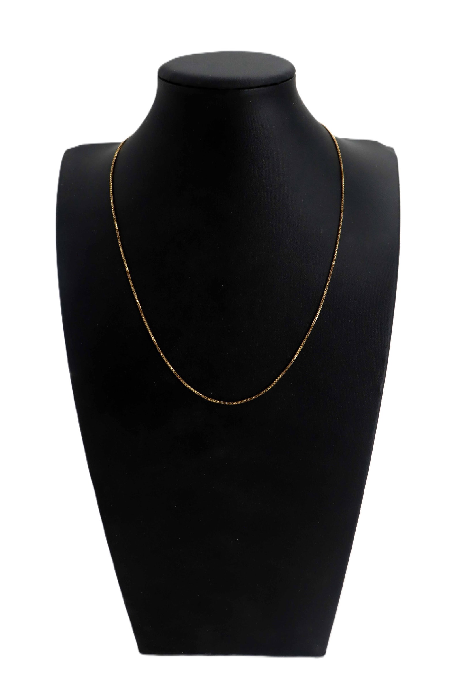 Marked 18k Yellow Gold Box Chain Necklace - 4.8 g.: Marked 18k Yellow Gold Box Chain Necklace - 4.8 g. Delicate yellow gold box chain necklace displayed on a black jewelry bust, featuring a classic design of small, square-shaped links that pr