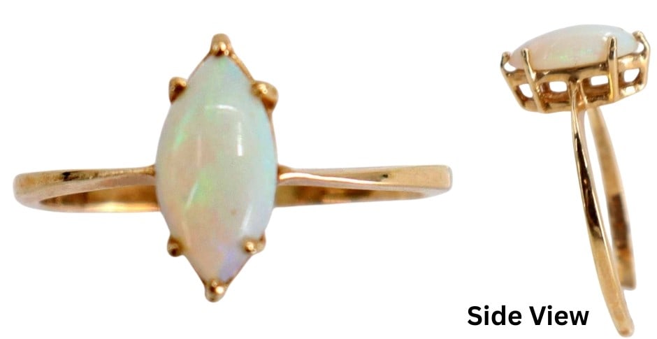 14k Gold and Opal Ring - Gross 1.7 g.: 14k Gold and Opal Ring - Gross .7 g.. Marked on interior band. Elegant 14k yellow gold bypass ring with vibrant oval opal cabochon with a colorful play-of-color. Marked on interior band. Siz