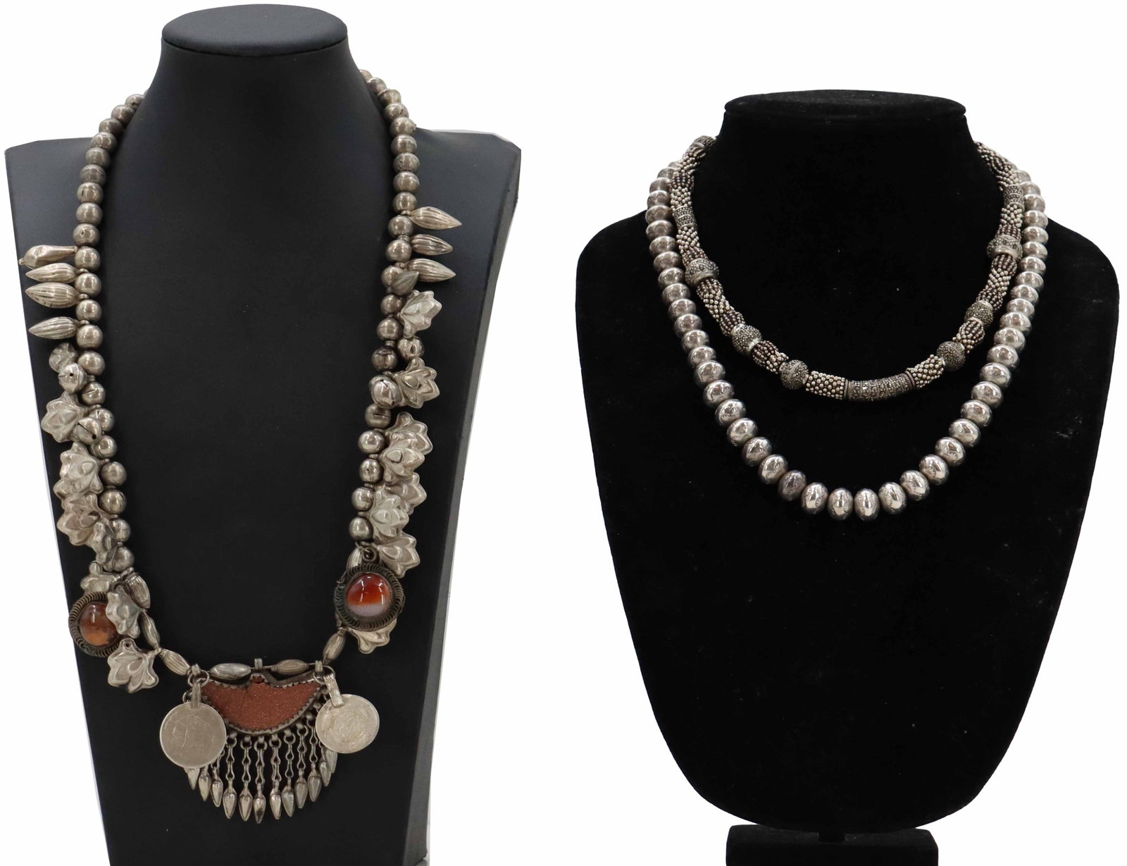 (3) Yemeni Bedouin Silver Toned Beaded Necklaces: (3) Yemeni Bedouin Silver Toned Beaded Necklaces. Two are more austere, with simple patterning or just larger beads. One is much more elaborate, incorporating coins, carved and polished stones, and