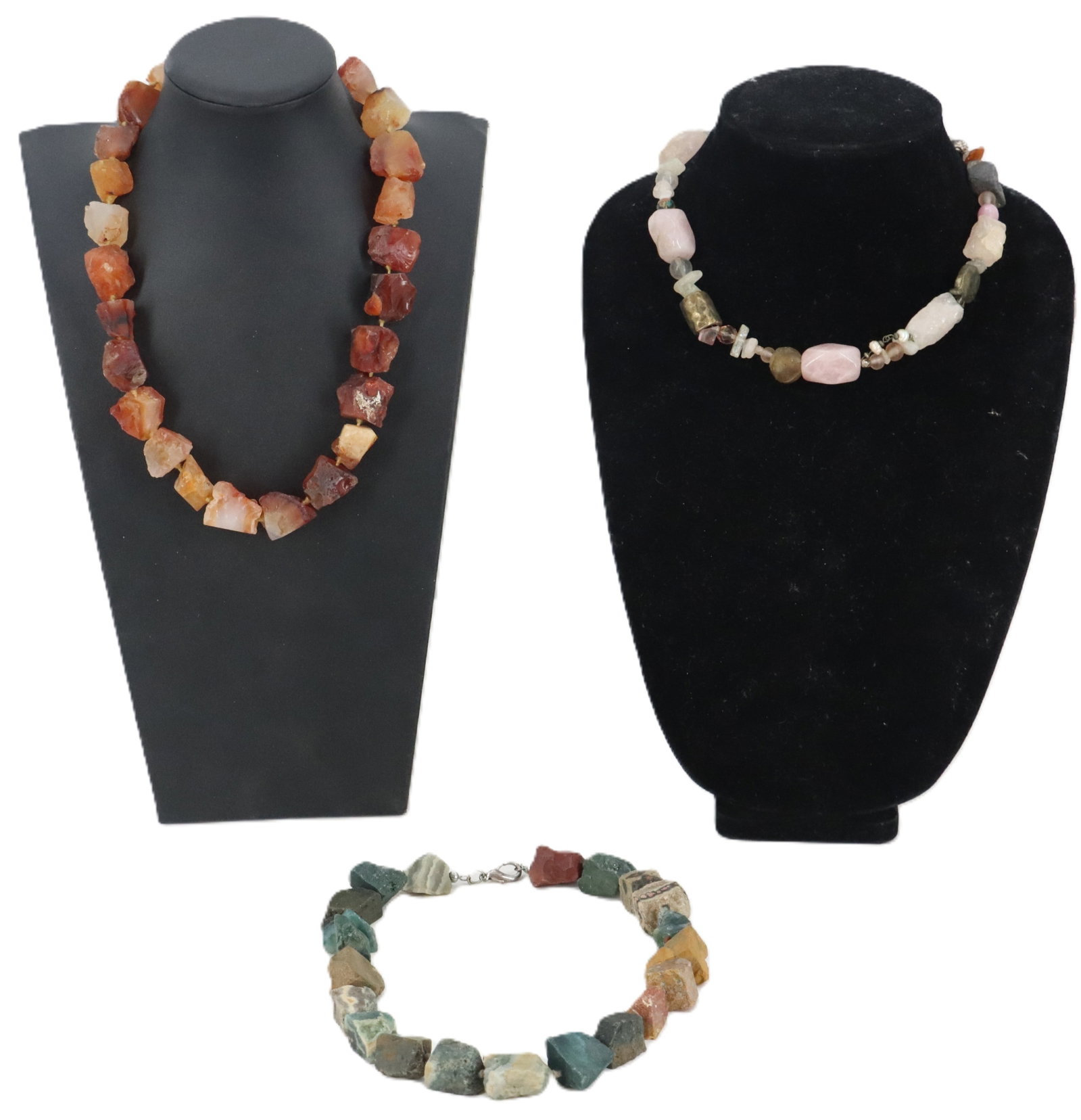 (3) Hardstone Necklaces: (3) Hardstone Necklaces. Carnelia, agate, and other stones, polished but left in a chunky state. Longest Length: 20 1/2 in. Long 