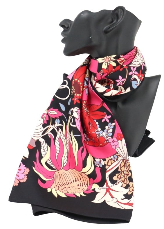 Salvatore Ferragamo Floral Silk Scarf: Salvatore Ferragamo Floral Silk Scarf. Vibrant silk scarf with bold floral design with pink, red, and cream botanical motifs set against a deep black background. Size: 35 x 35 in. Sa
