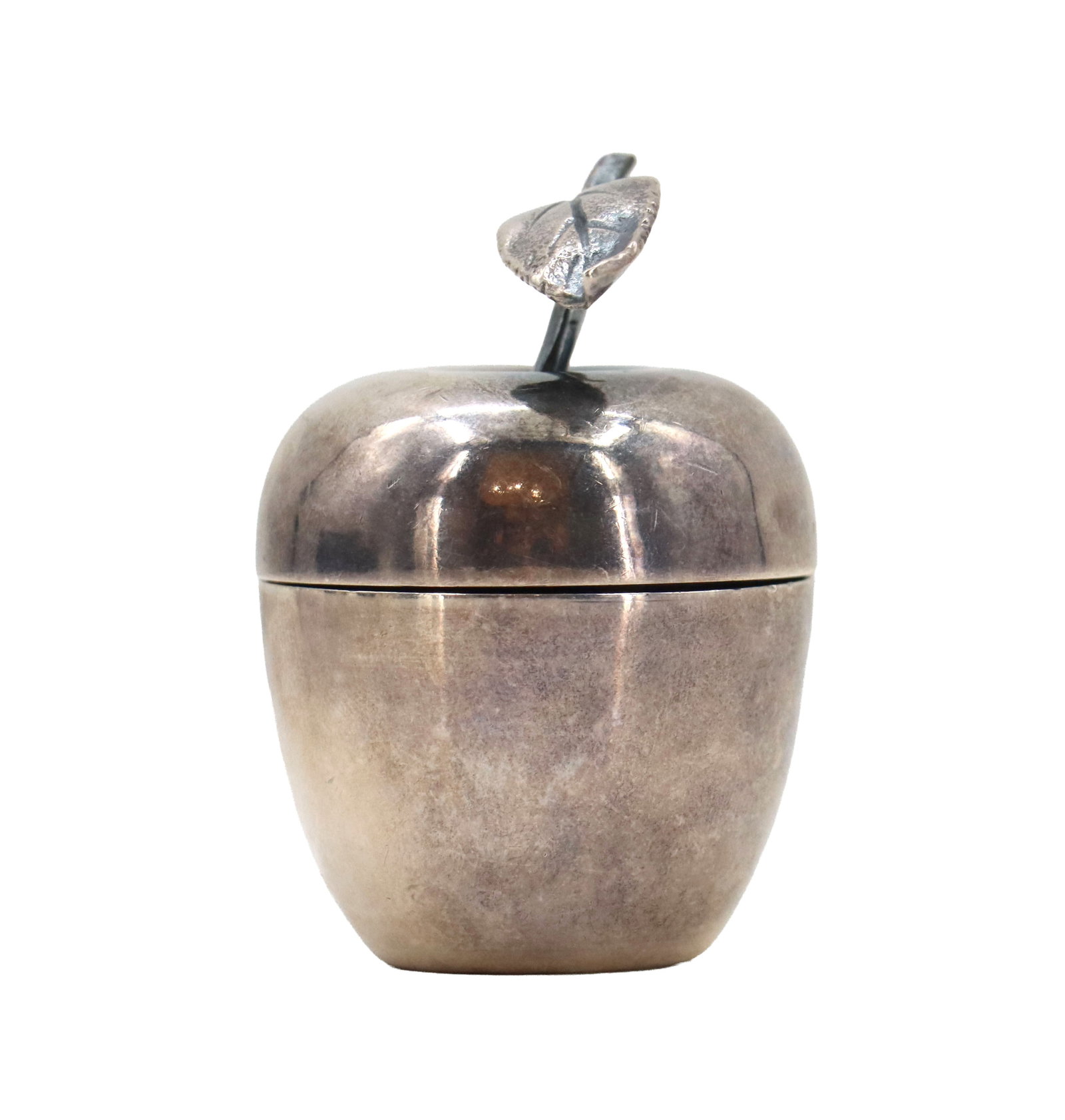 Tiffany & Co. Sterling Silver Apple Form Trinket Box - 0.895 ozt.: Tiffany & Co. Sterling Silver Apple Form Trinket Box - 0.895 ozt. Stem on the lid to open it. Marked on the underside with a pattern number indicating it was made some time in the mid
