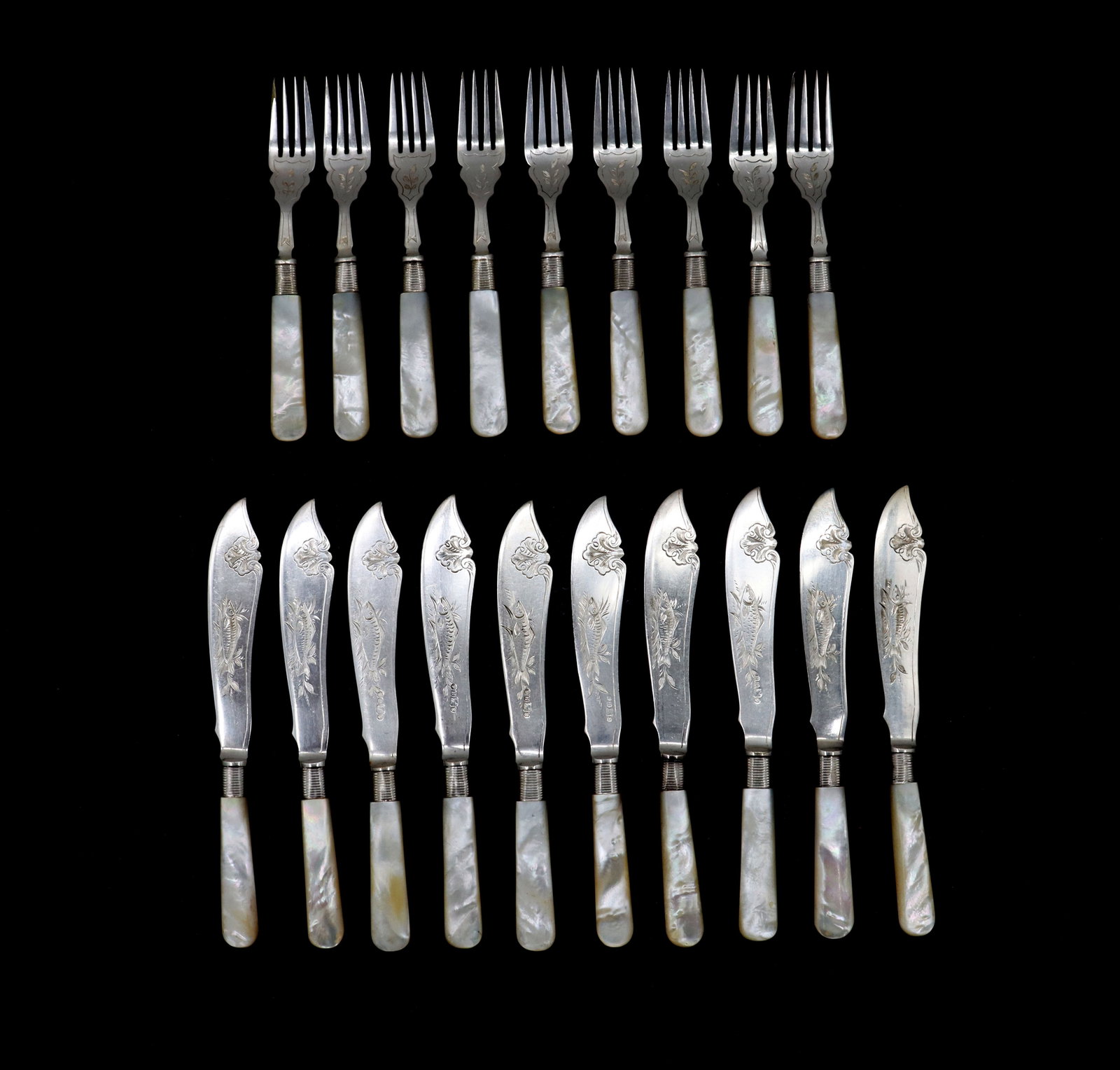 (19) English Flatware with Mother of Pearl Handles: (19) English Flatware with Mother of Pearl Handles. Lot comprised of nine forks and ten butter spreader knives with ornate relief, attached to mother-of-pearl handles. Hallmarks on stems. Size: 9 x 1
