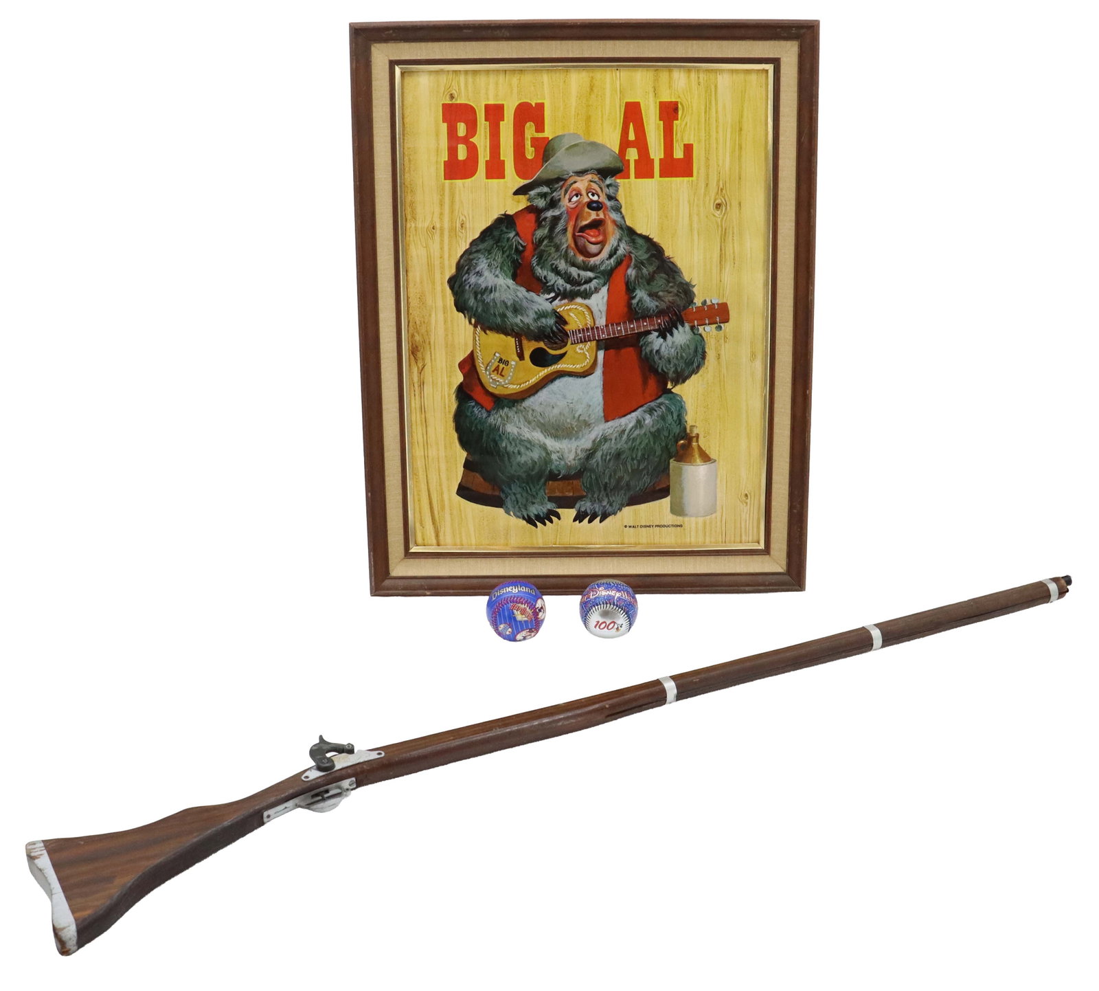 (4) Various Disneyland Memorabilia Items - Country Bears Poster, Pirates of the Caribbean Replica: (4) Various Disneyland Memorabilia Items - Country Bears Poster, Pirates of the Caribbean Replica Rifle, Two Baseballs. Collection features a framed "Big Al" poster from the Country Bear Jam
