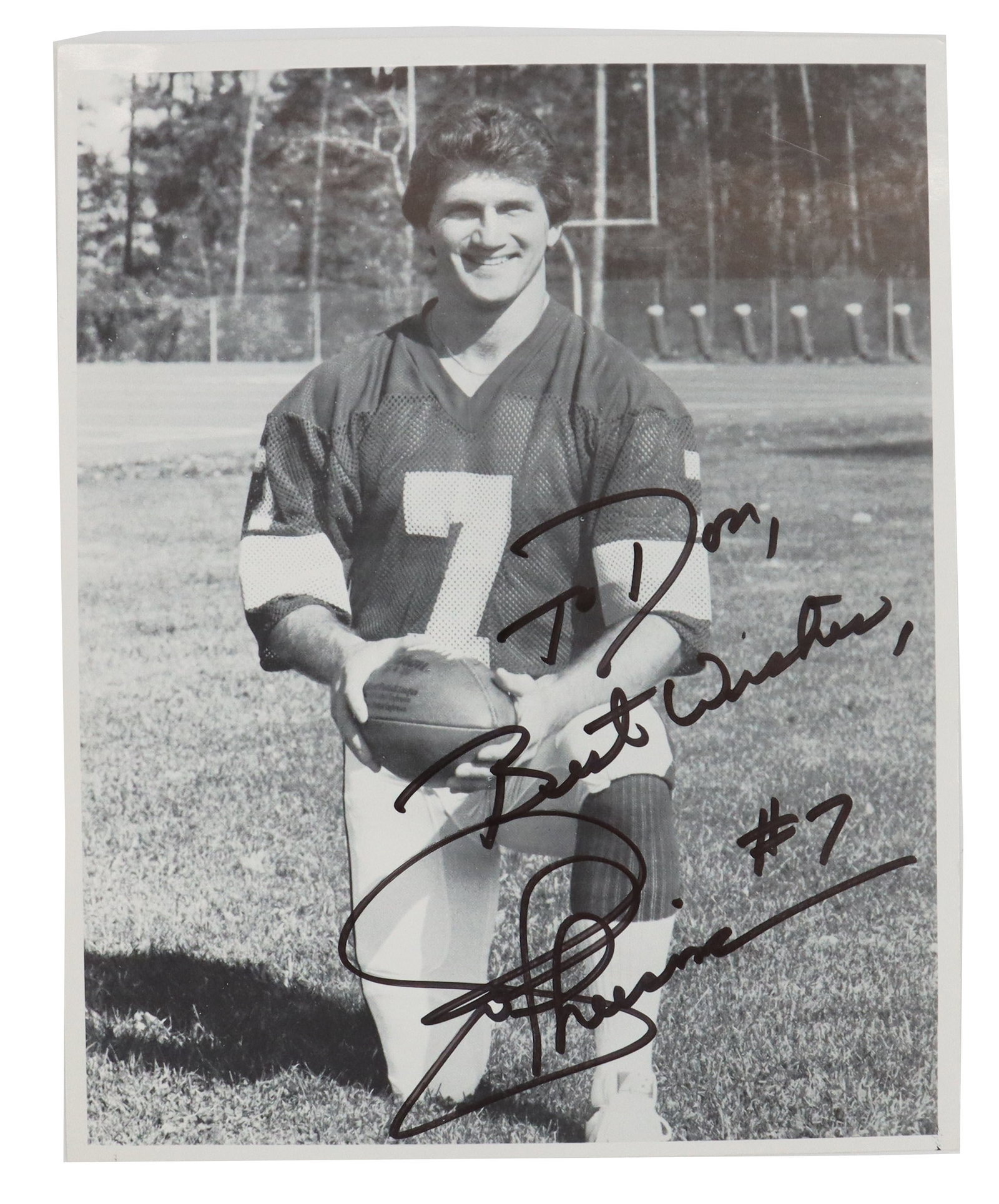 Joe Theismann (Born 1949) American, Black and White Signed Football Player Photo: Joe Theismann (Born 1949) American, Black and White Signed Football Player Photo. Depicts the former quarterback in his youth on the field, holding a football and wearing jersey #7. It is