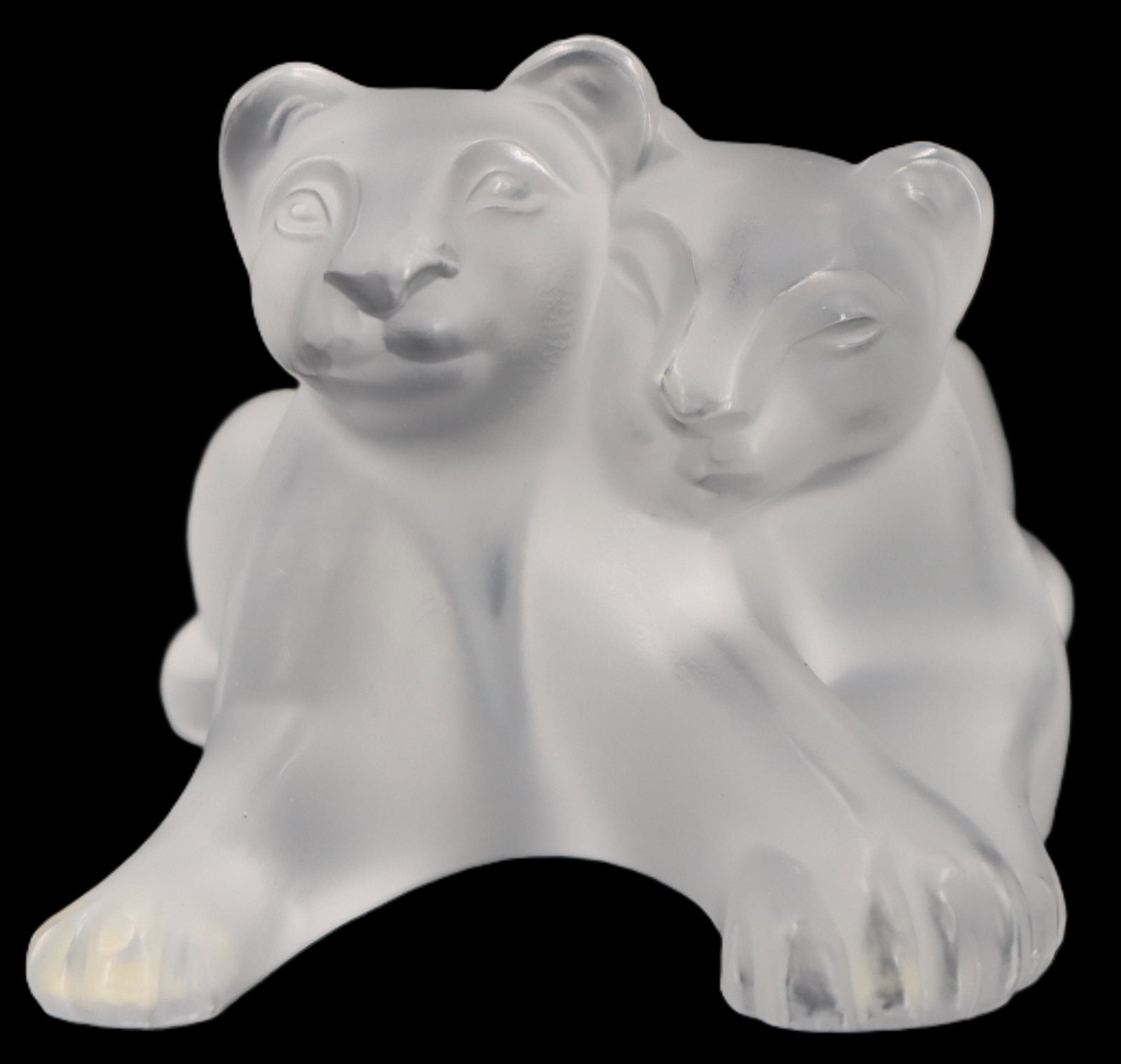 Mid Century Lalique Frosted Crystal Two Felines Figure: Mid Century Lalique Frosted Crystal Two Felines Figure. The two are snuggled together side by side, their soft features rendered beautifully in one solid piece of crystal. Signed "M. Lalique"