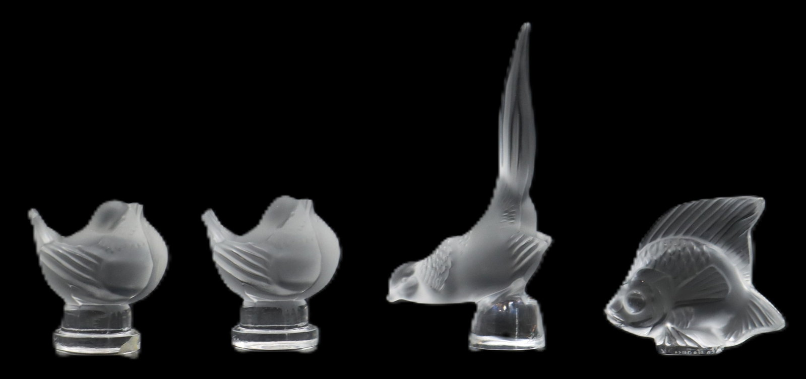 (4) French Lalique Crystal Decorative Animal Figurines: (4) French Lalique Crystal Decorative Animal Figurines. Includes 2 matching plump birds, 1 bird with the tail stretched up high, and 1 fish. All signed on the underside or side of base. Largest