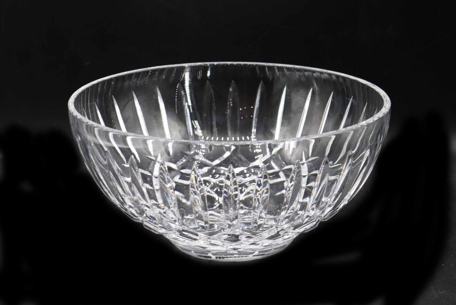 Waterford Crystal Araglin Bowl: Waterford Crystal Araglin Bowl. Characterized by the diamond and vertical wedge cuts around the body. Marked on underside. Condition: Cracked near bottom. Size: 9 x 9 x 4 1/4 in. Waterford