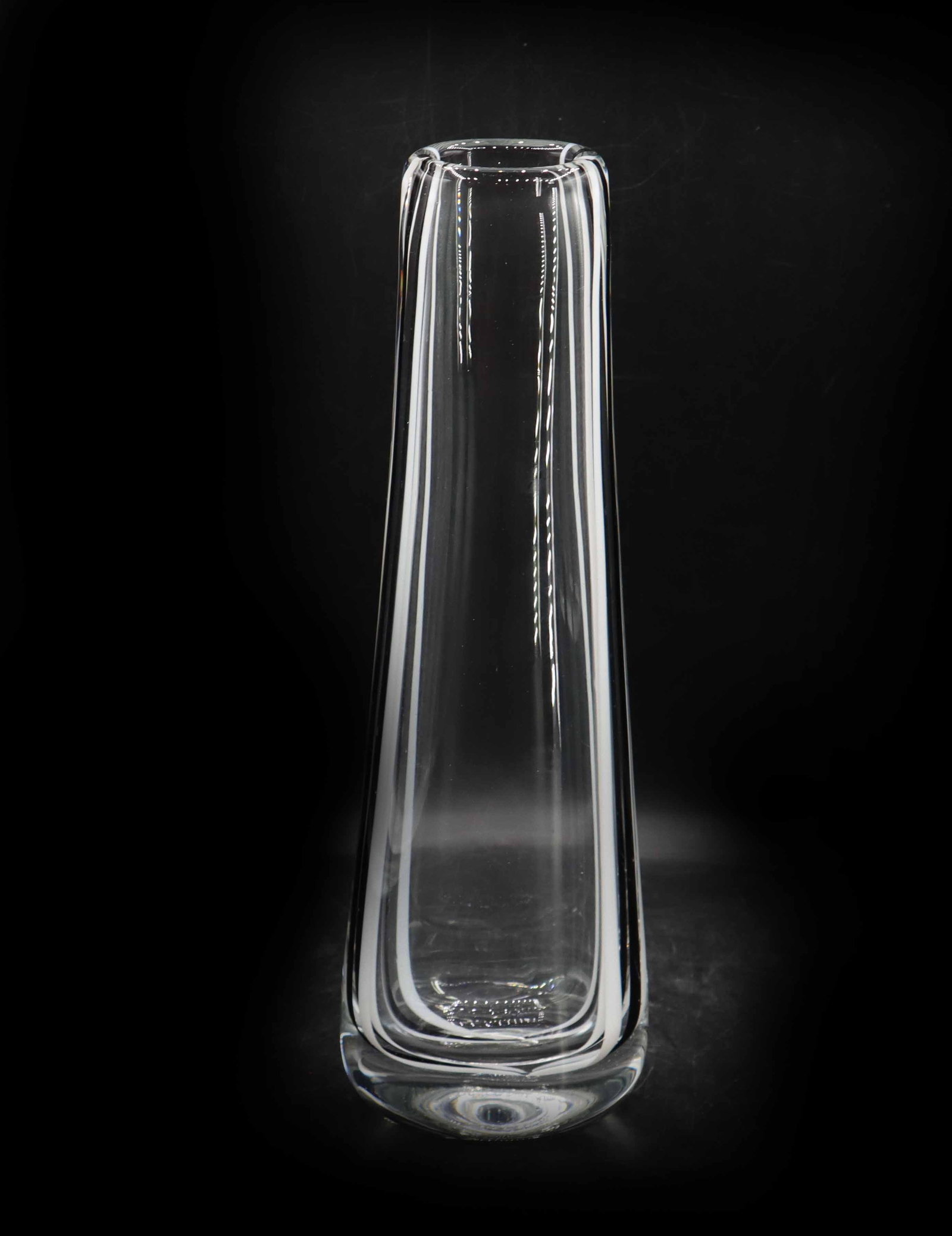 In the Manner of Vicke Lindstrand (1904-1983) Swedish, Kosta Glasbruk Art Glass Vase: In the Manner of Vicke Lindstrand (1904-1983) Swedish, Kosta Glasbruk Art Glass Vase. Tall and thin with his signature black filament through the middle on the sides, bookended by two white strips tha