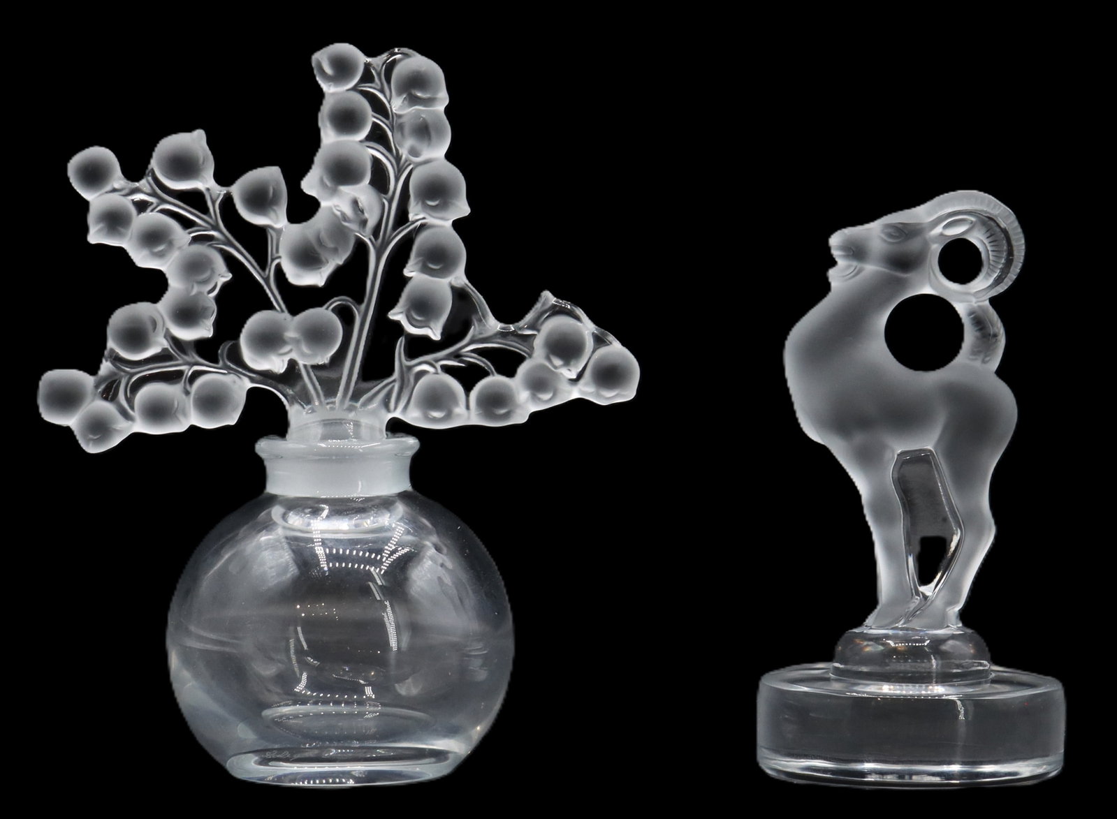 (2) Lalique Crystal Frosted and Clear Decorative Pieces: (2) Lalique Crystal Frosted and Clear Decorative Pieces. One is an empty Clairefontaine "Lily of the Valley" perfume bottle with an exquisite floral stopper, and the other is the "