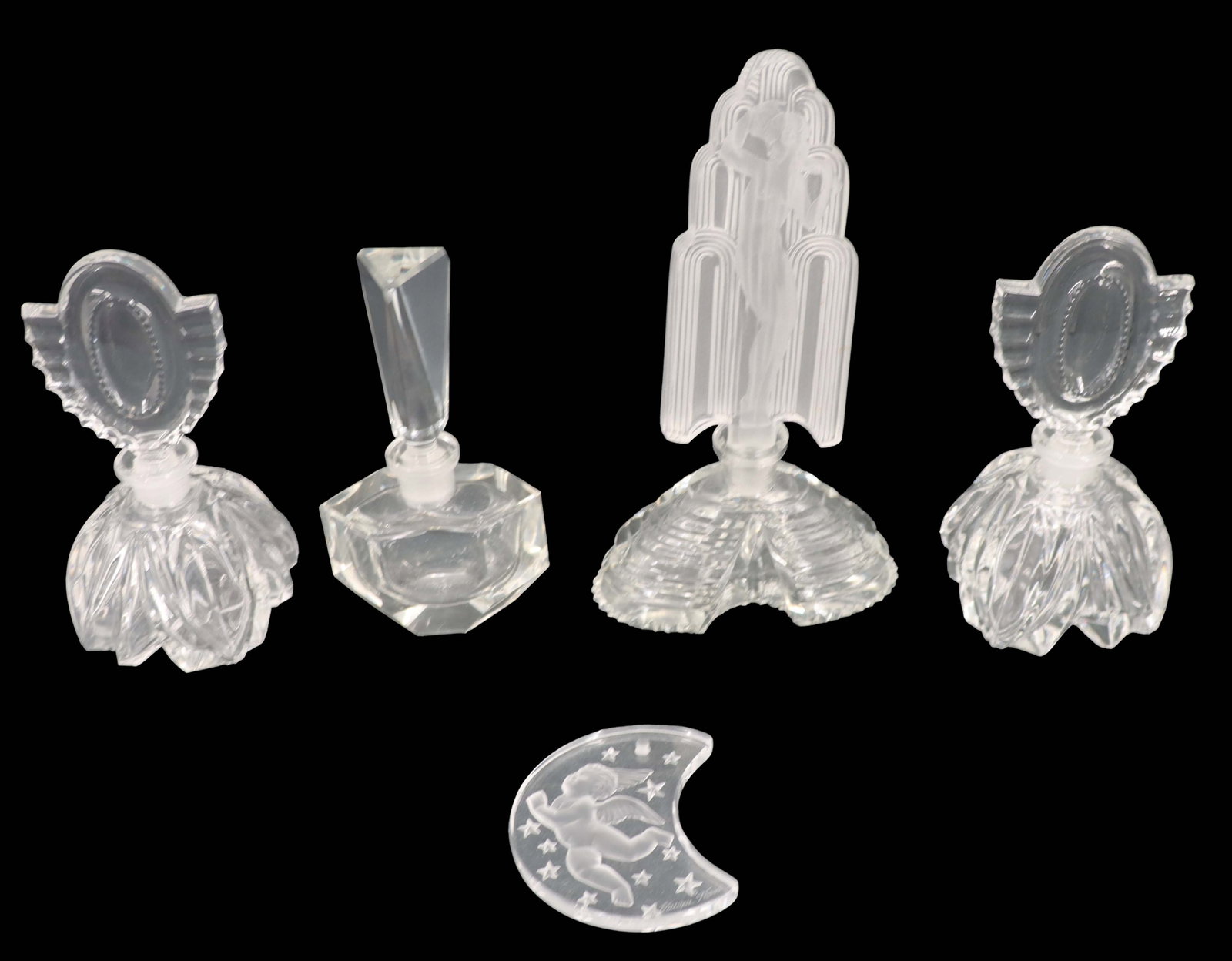 (4) Czech Art Deco Crystal Perfume Bottles and (1) Lalique Crystal Ornament: (4) Czech Art Deco Crystal Perfume Bottles and (1) Lalique Crystal Ornament. The Czech pieces include 2 matching bottles with scarab pattern stoppers, one with a simple straight stopper, and one with 