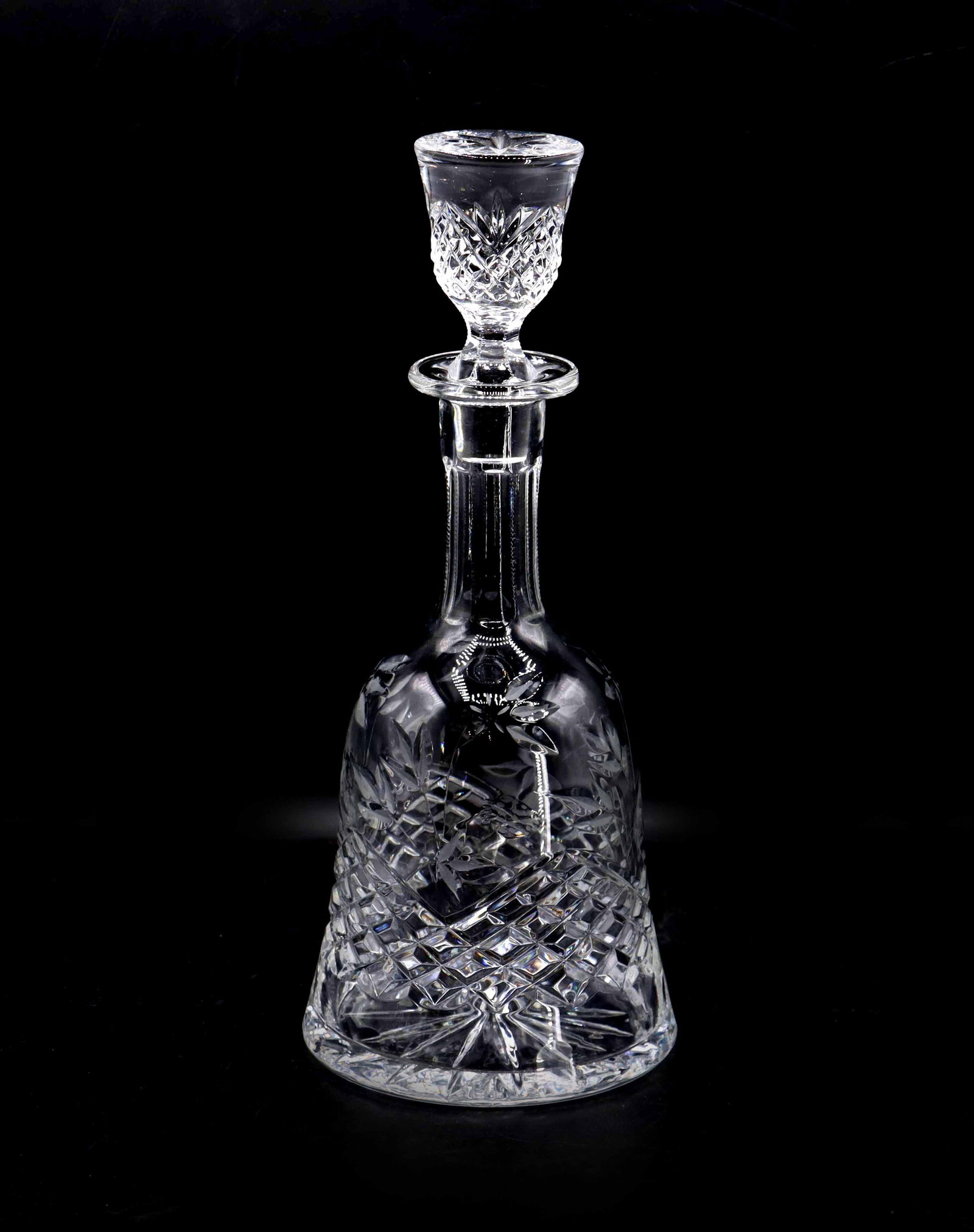 Waterford-Wedgwood Cut Crystal Sovereign Decanter: Waterford-Wedgwood Cut Crystal Sovereign Decanter. The bell shaped body and matching stopper are in the Sovereign pattern with flowers, leaves, strawberries and crisscross motifs. Produced i
