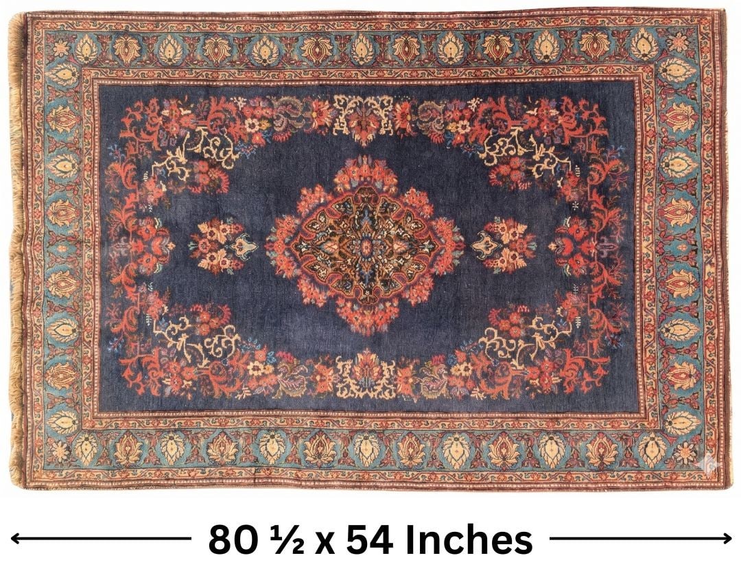 Persian Sarouk Wool Rug: Persian Sarouk Wool Rug. A beautiful navy blue field in center is filled with rich reddish floral works and a God's eye medallion with two small bouquets bookending it. The border has a lighter